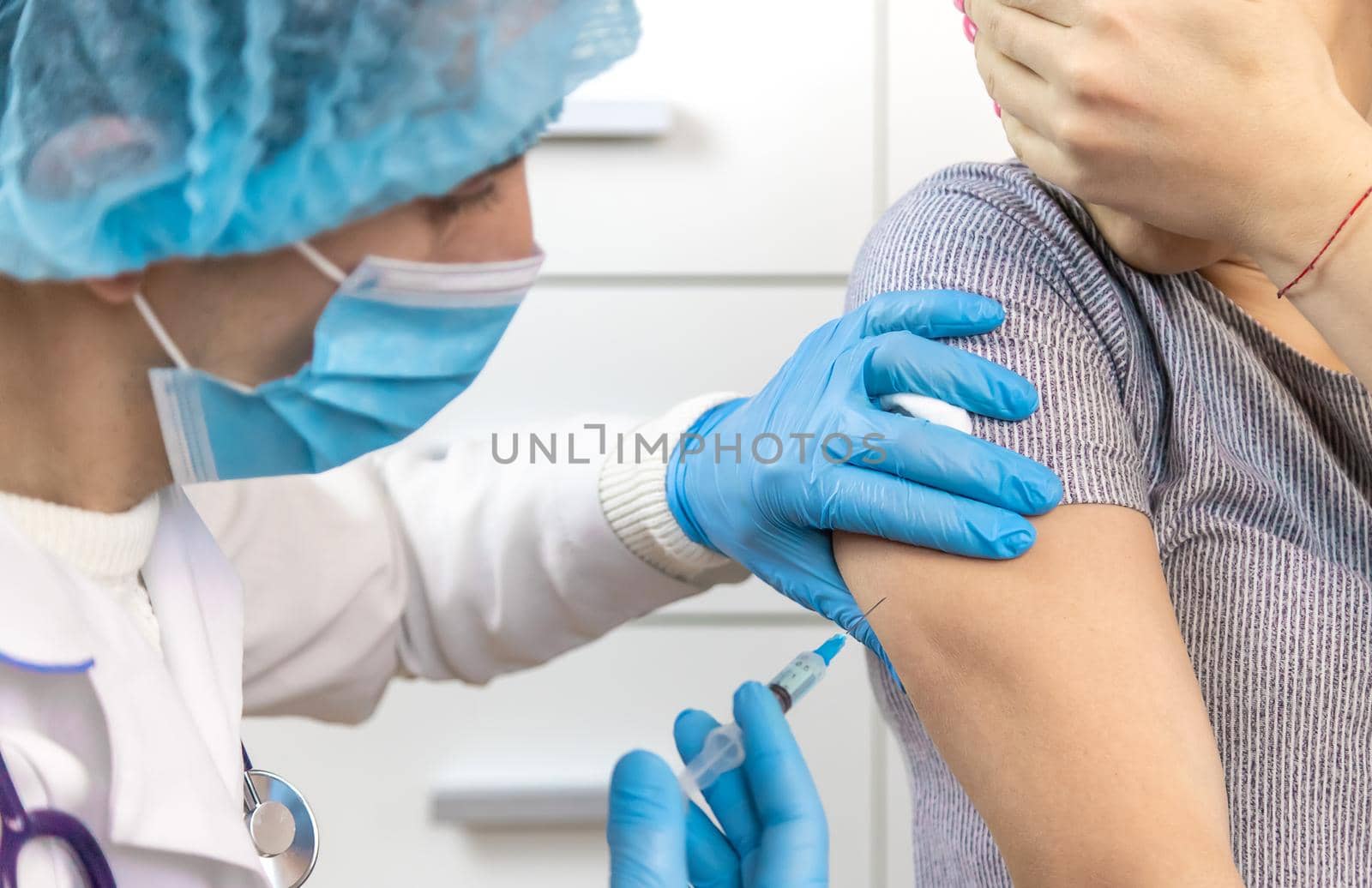 Vaccination of people. Hand injection. Selective focus people