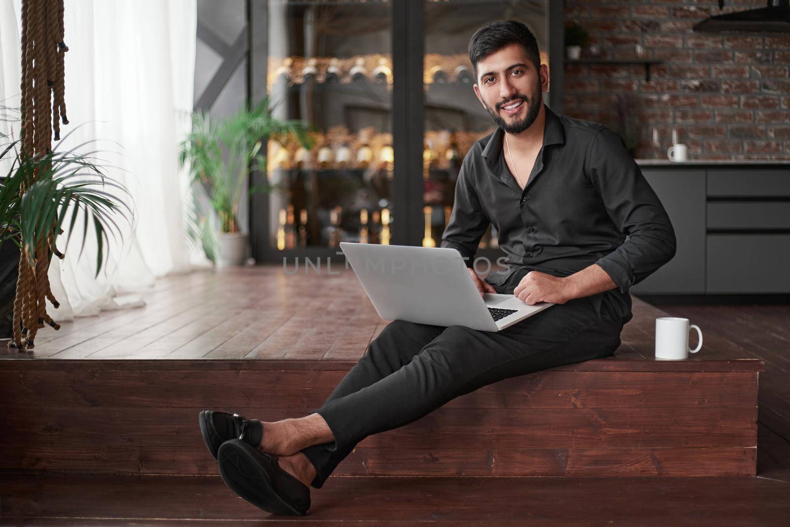 close-up. business owner using a laptop while sitting on the floor.
