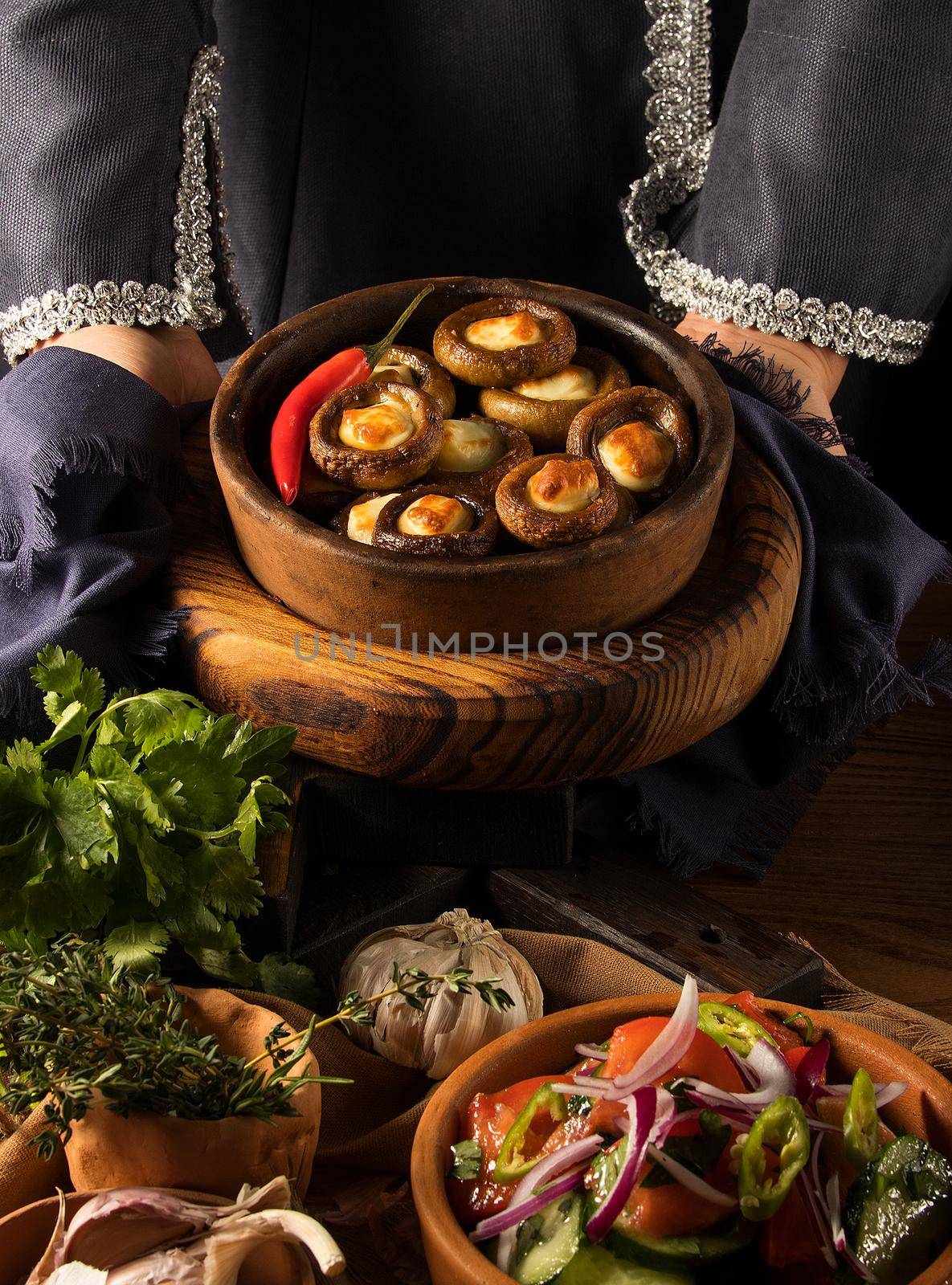 Shot of a person putting dishes on the table by A_Karim