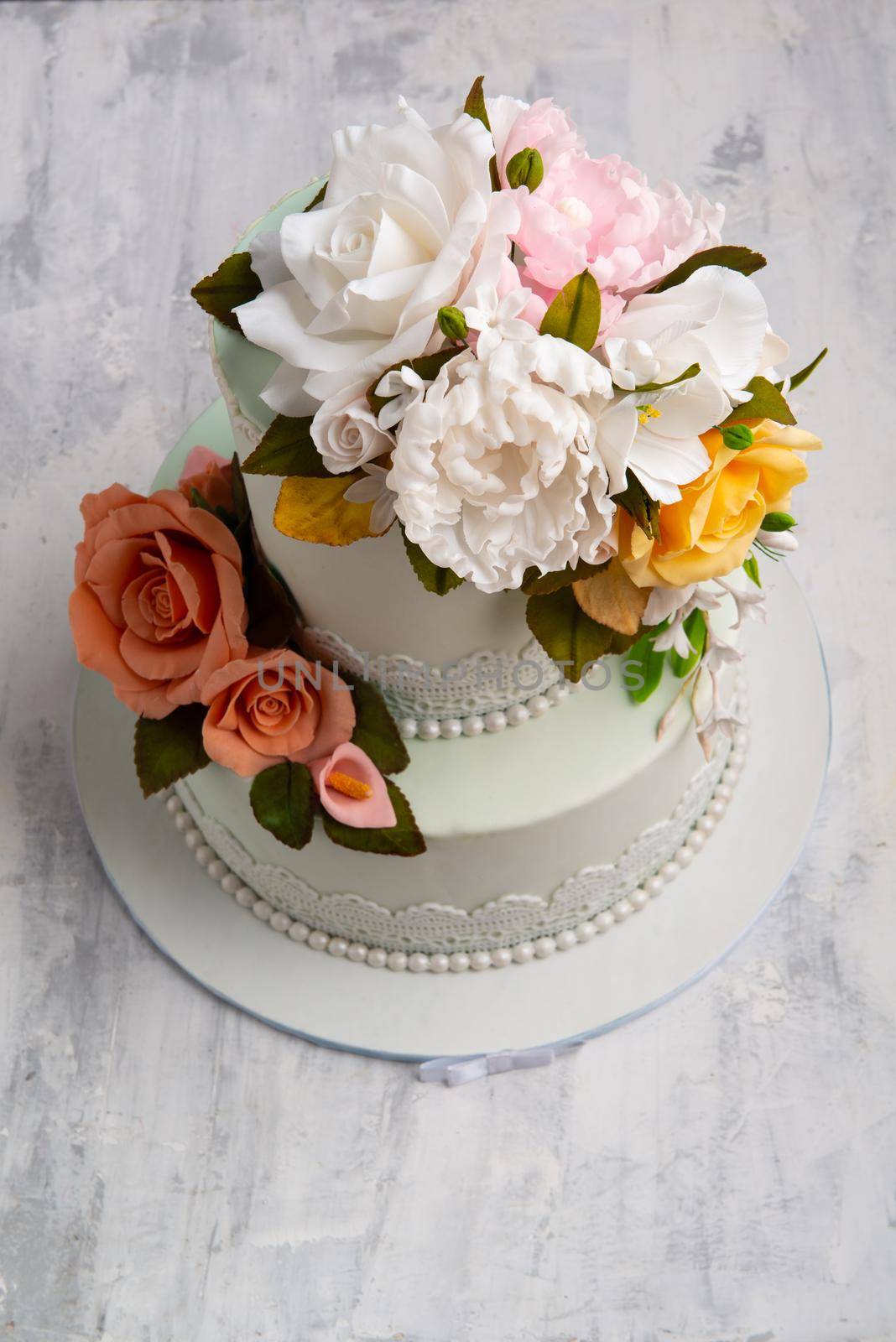 Top view shot of a weeding cake designed by flowers. by A_Karim