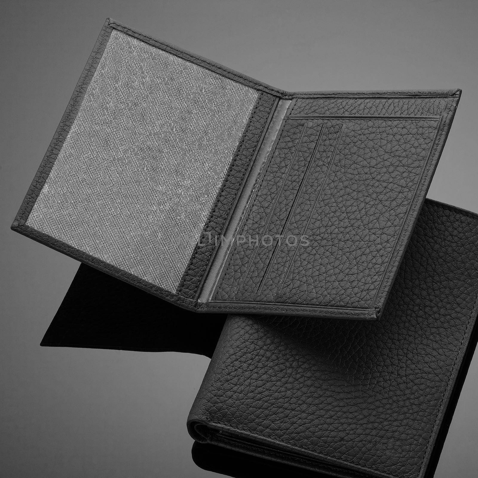 Closeup of a fashionable leather wallet on a dark background by A_Karim