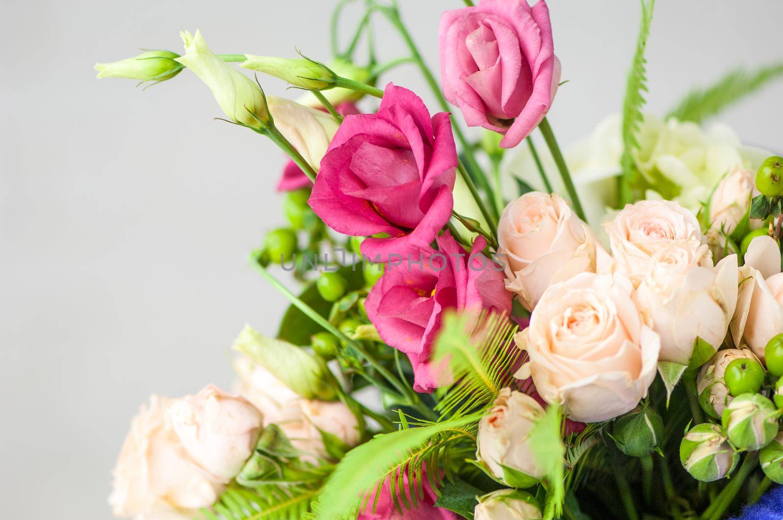 Closeup of beautiful fresh with white roses and pink lisianthus in a bouquet by A_Karim