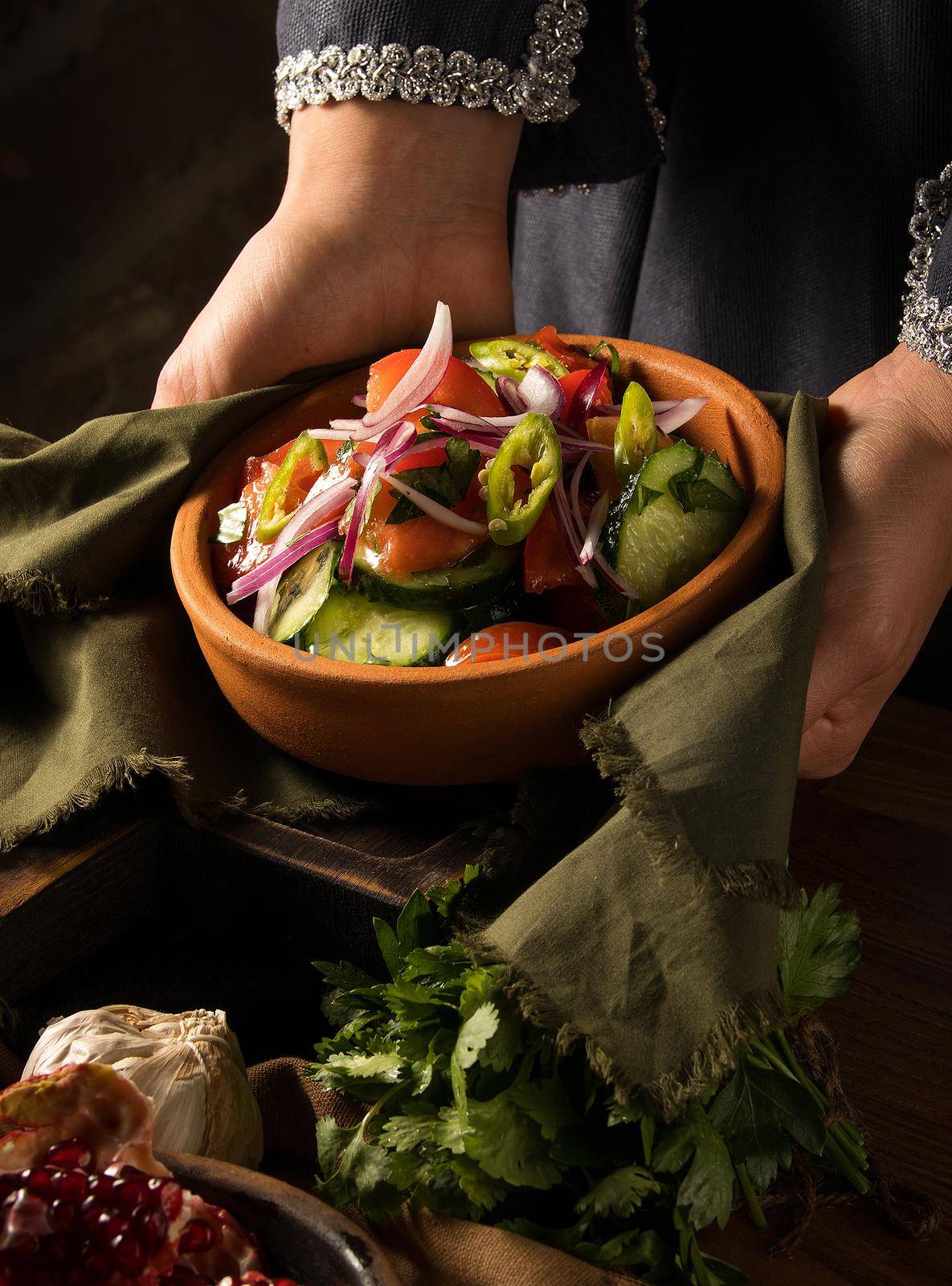 Shot of a person putting dishes on the table by A_Karim