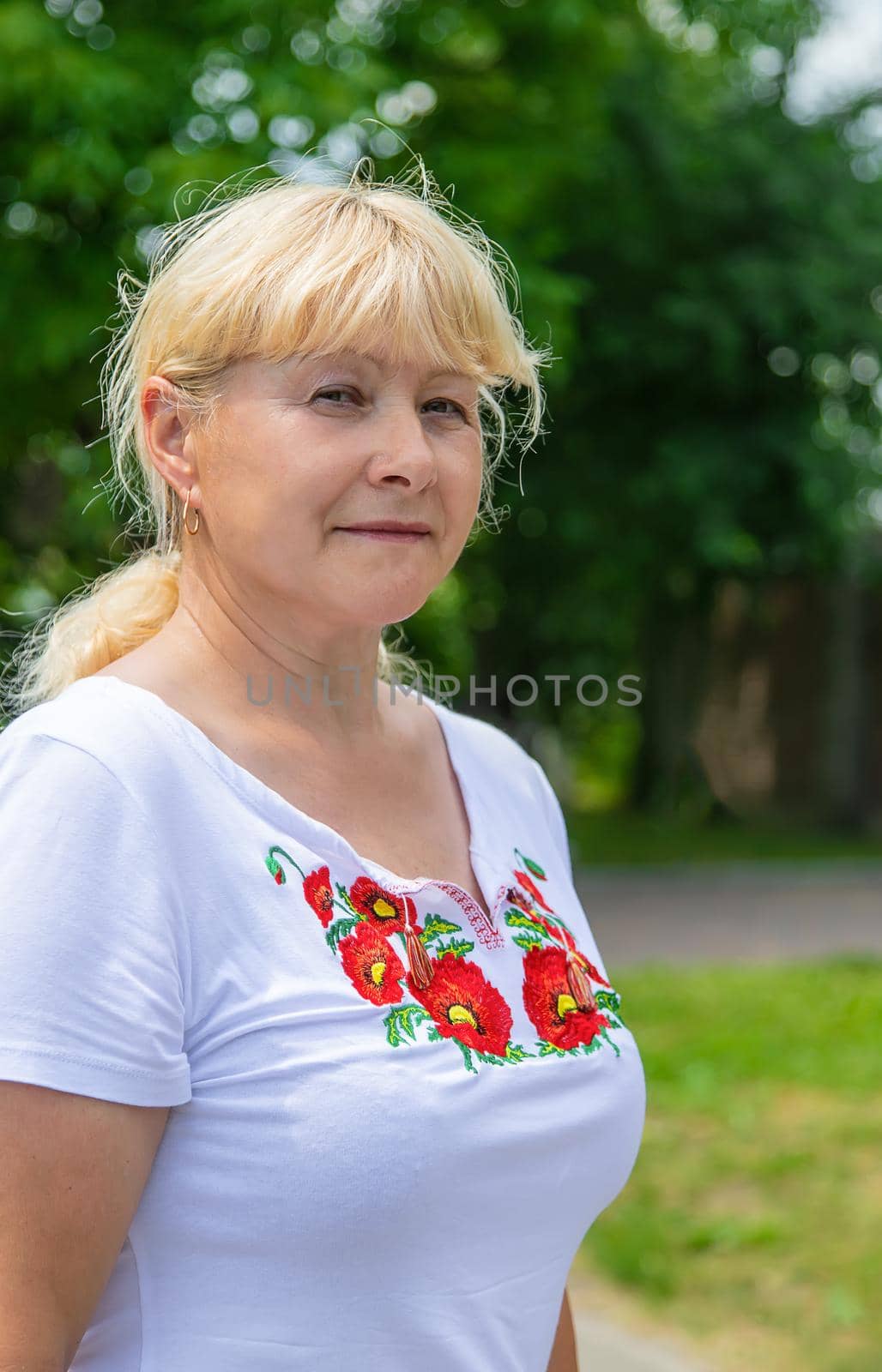 A Ukrainian woman in an embroidered shirt. Selective focus. vishivanka