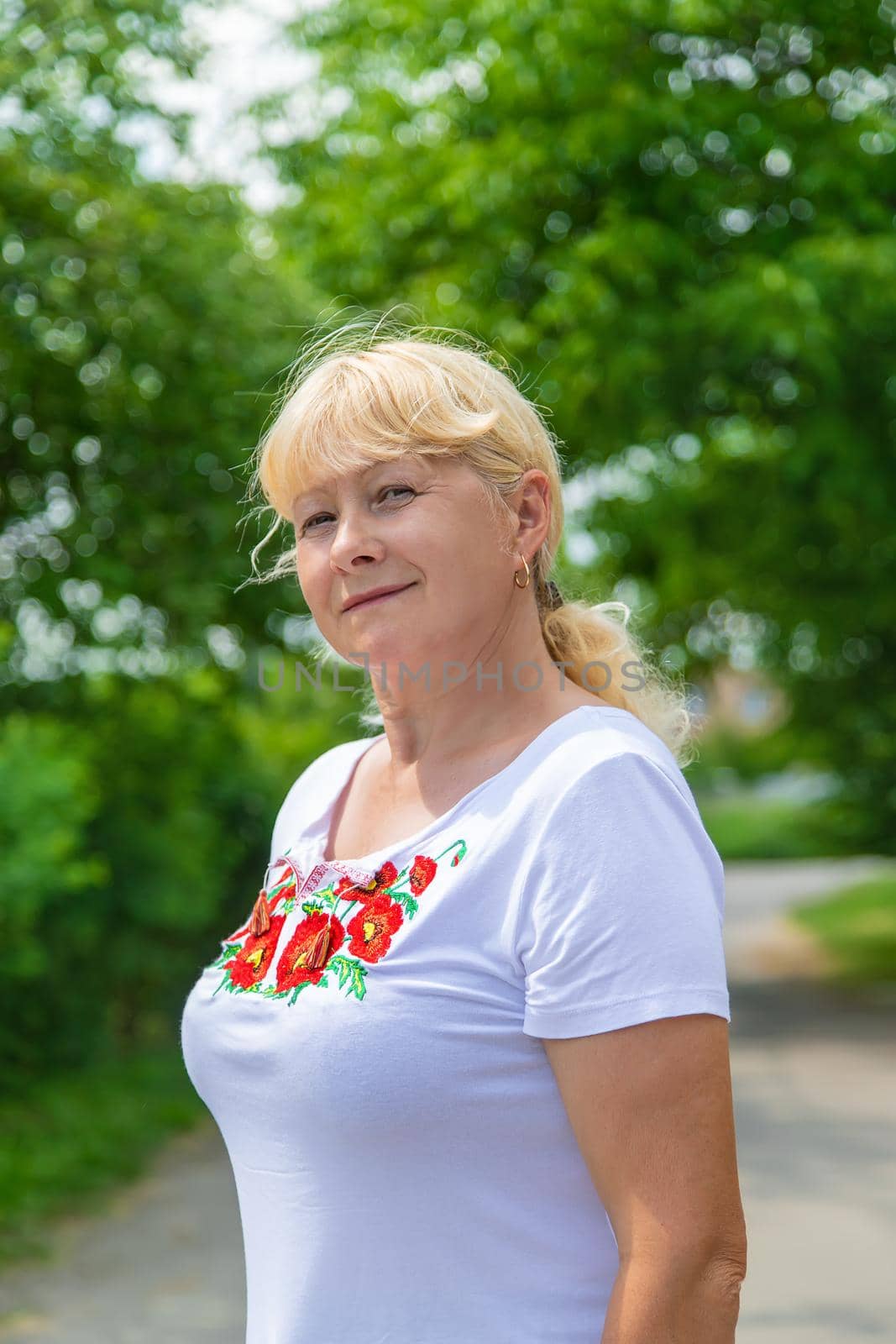 A Ukrainian woman in an embroidered shirt. Selective focus. vishivanka