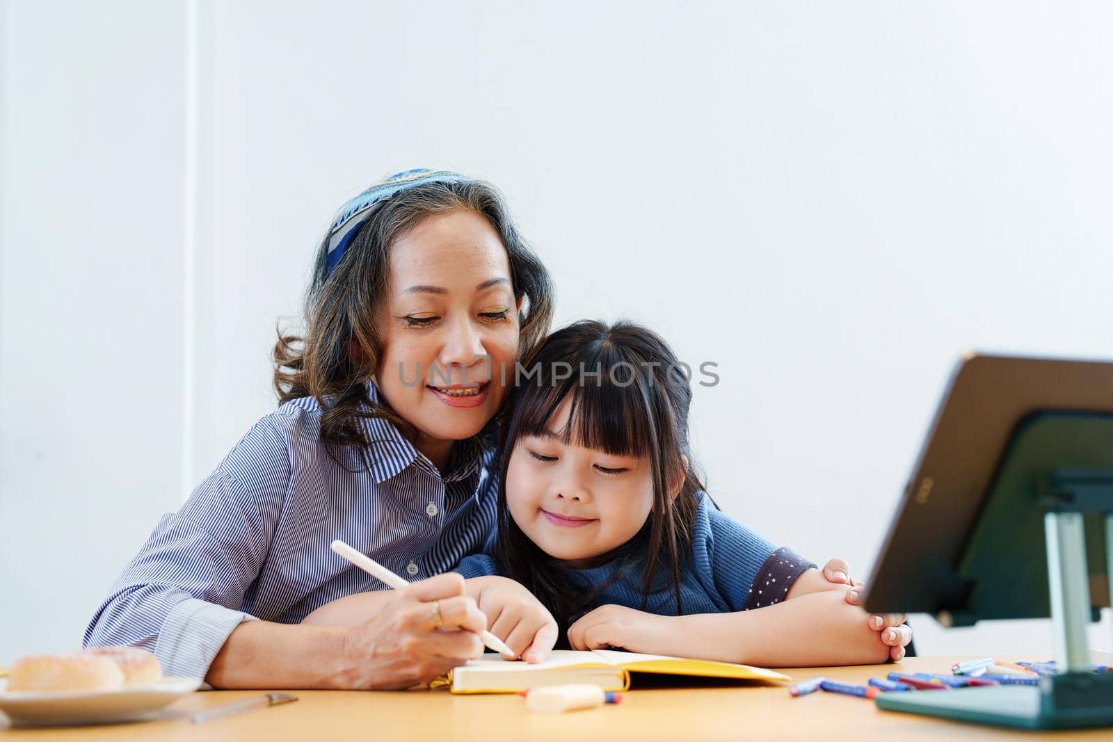 Asian portrait, grandchild granddaughter grandma grandmother and granddaughter happily join in activities to enhance skills for grandchildren by Manastrong