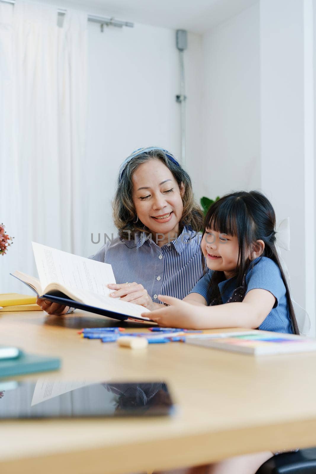 Asian portrait, grandchild granddaughter grandma grandmother and granddaughter happily join in activities to enhance skills for grandchildren.