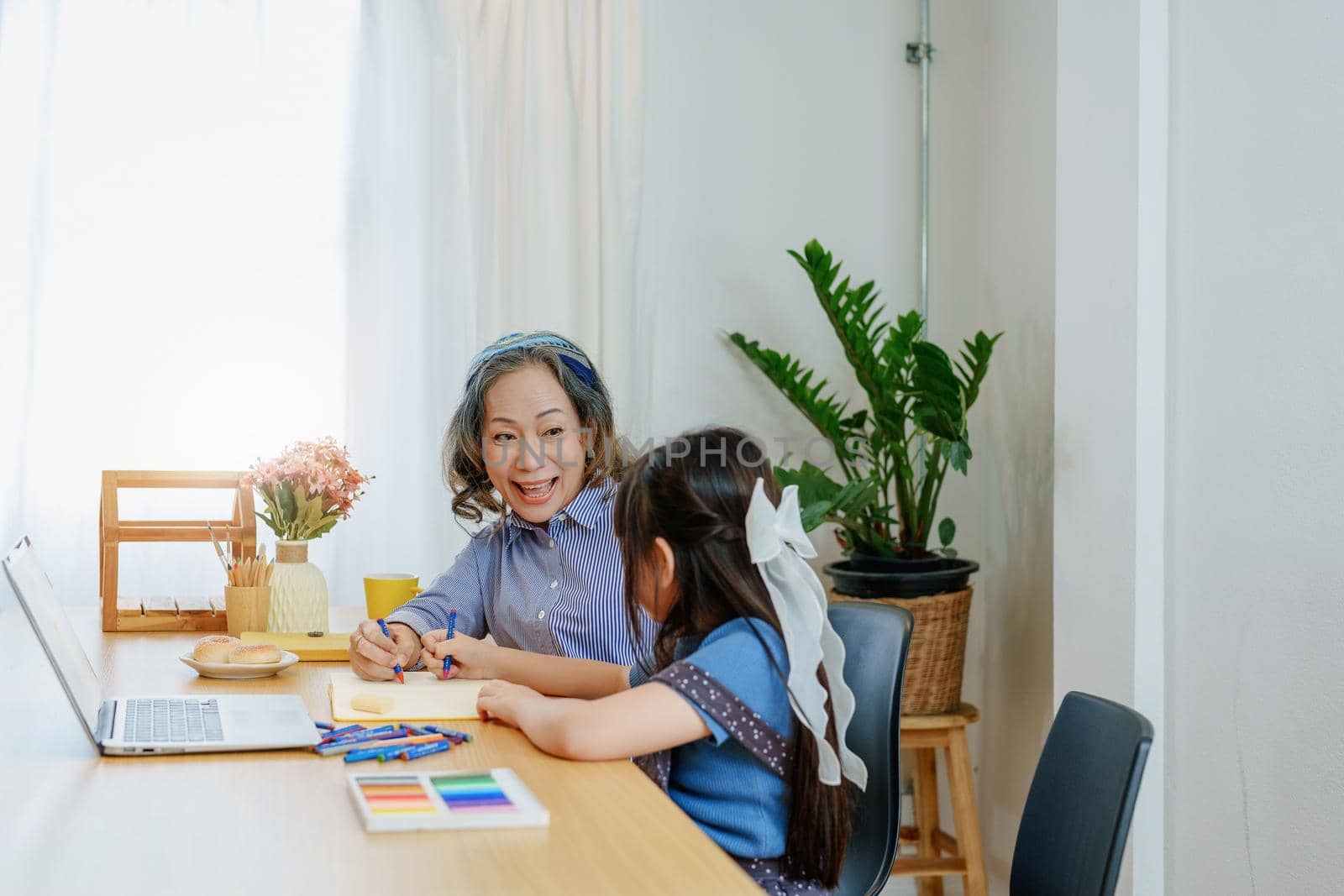 Asian portrait, grandchild granddaughter grandma grandmother and granddaughter happily join in activities to enhance skills for grandchildren by Manastrong