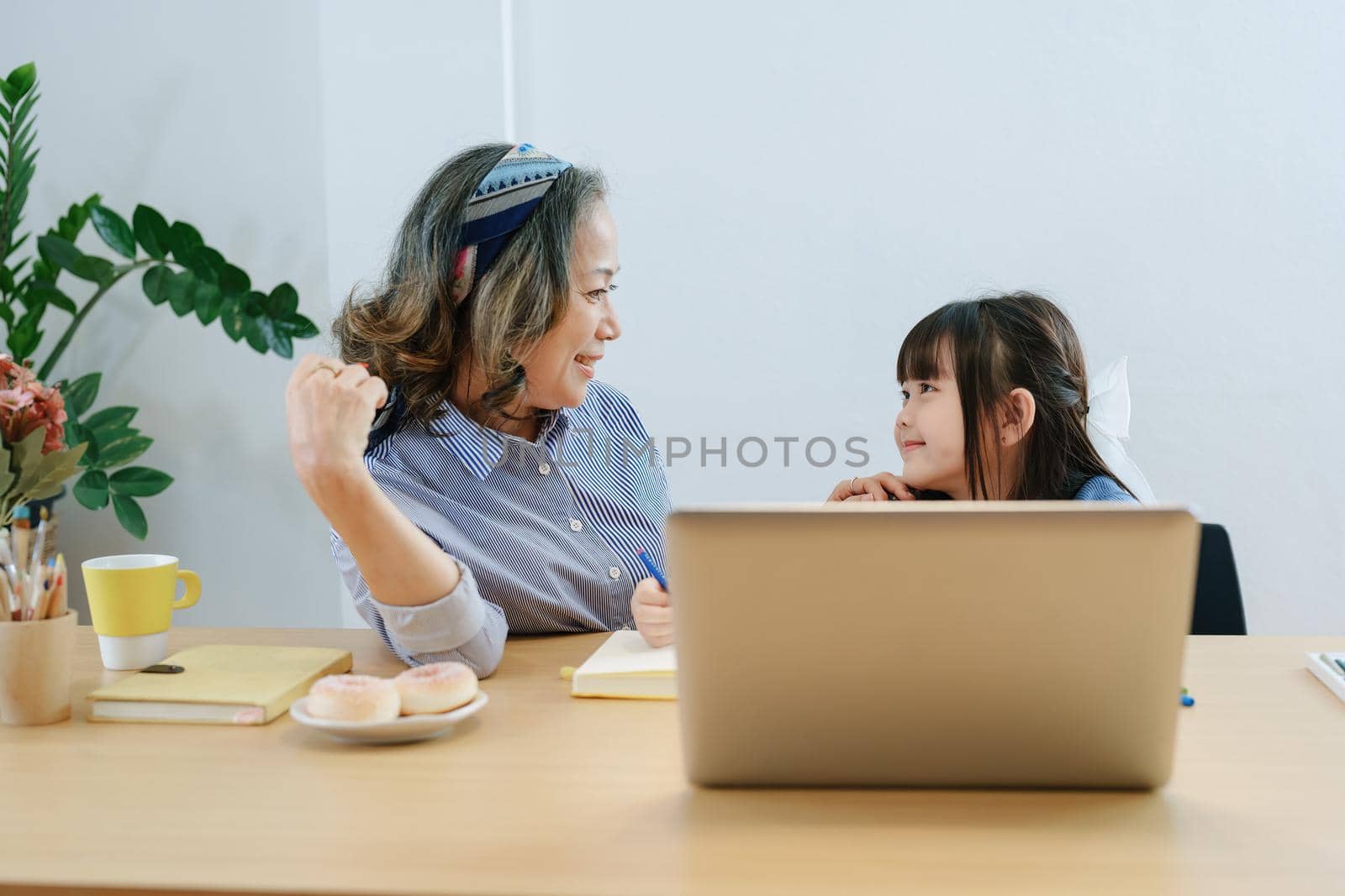 Asian portrait, grandchild granddaughter grandma grandmother and granddaughter happily join in activities to enhance skills for grandchildren by Manastrong