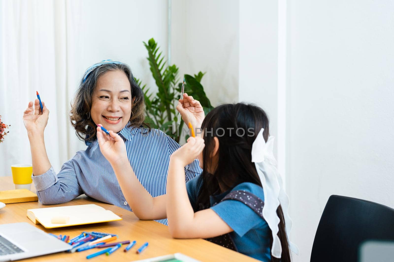 Asian portrait, grandchild granddaughter grandma grandmother and granddaughter happily join in activities to enhance skills for grandchildren by Manastrong