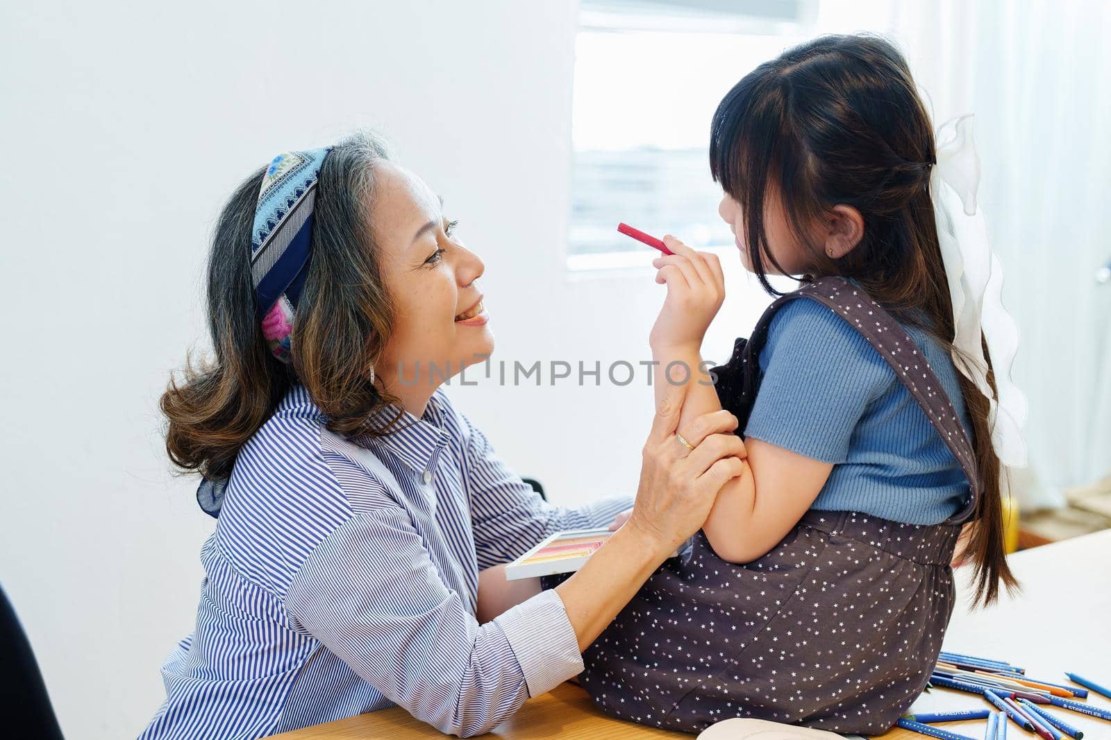 Asian portrait, grandchild granddaughter grandma grandmother and granddaughter happily join in activities to enhance skills for grandchildren.