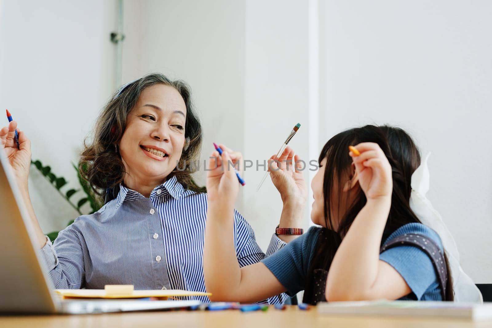 Asian portrait, grandchild granddaughter grandma grandmother and granddaughter happily join in activities to enhance skills for grandchildren by Manastrong