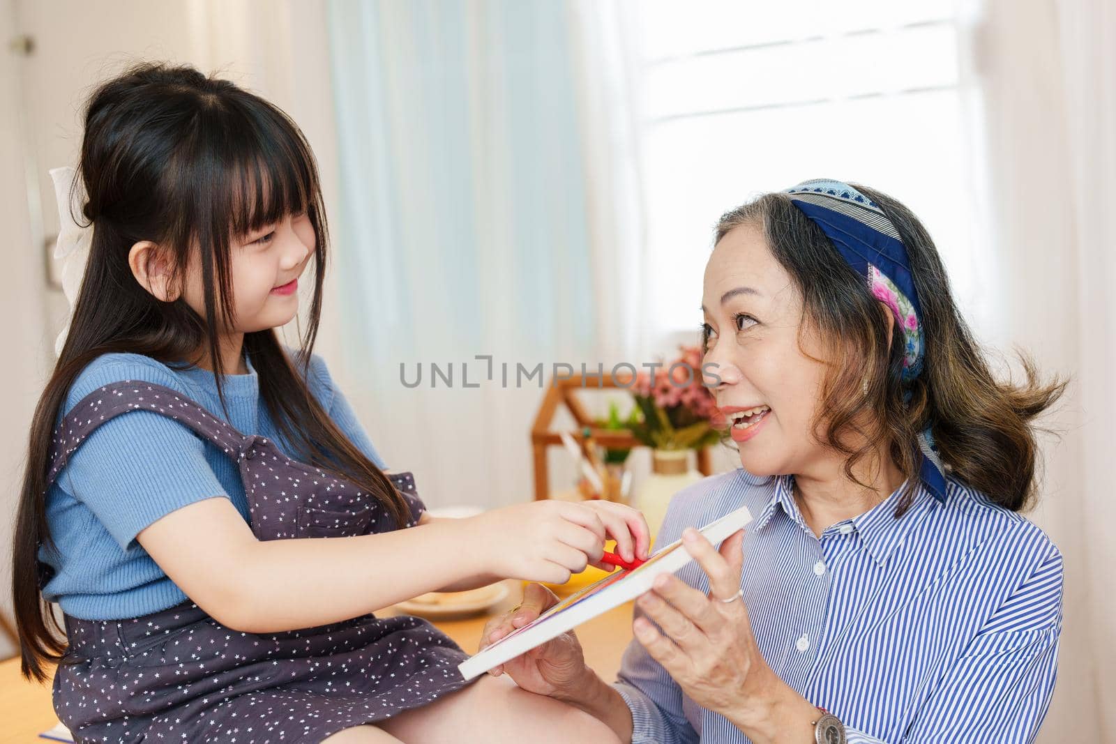 Asian portrait, grandchild granddaughter grandma grandmother and granddaughter happily join in activities to enhance skills for grandchildren.