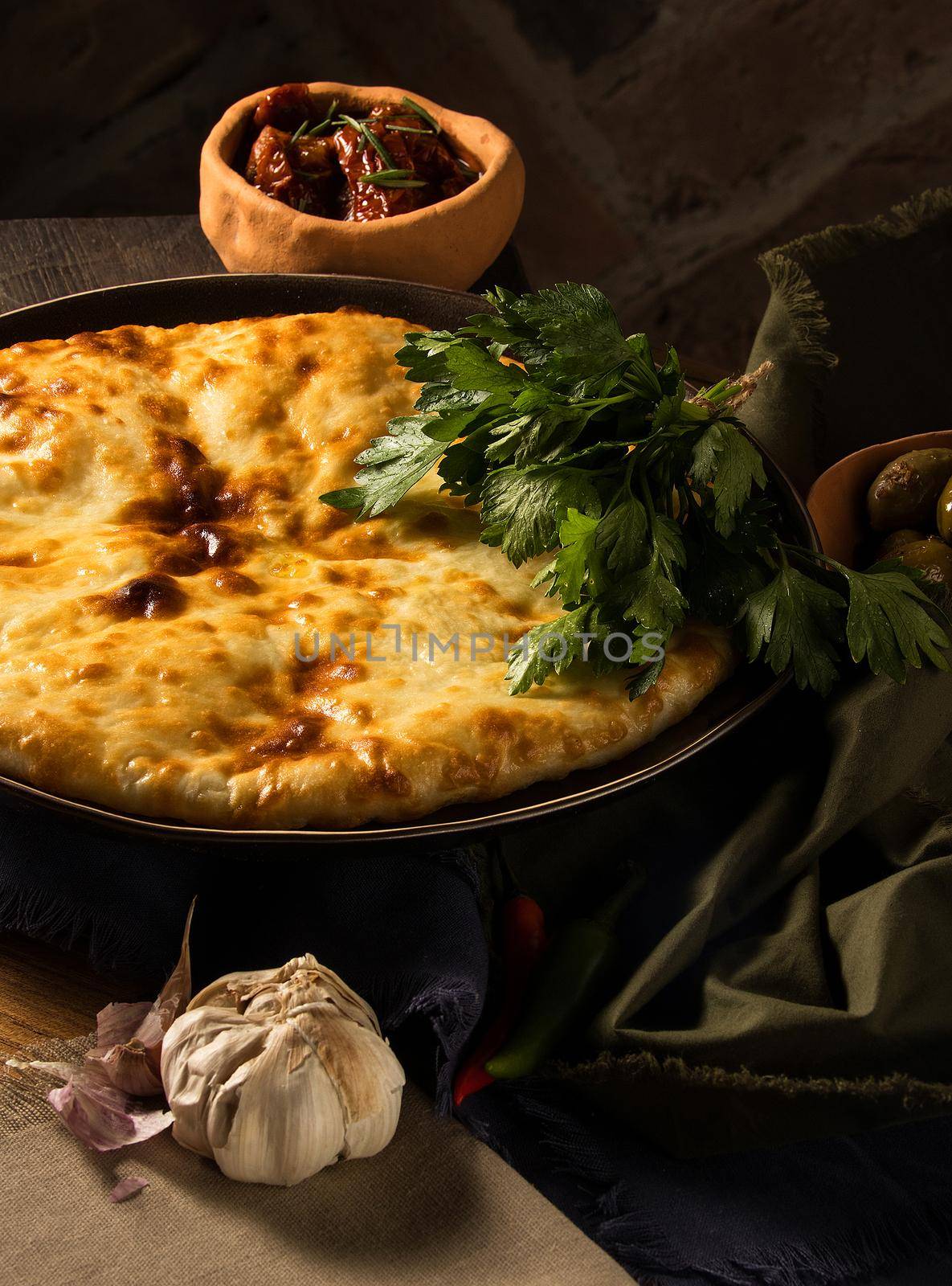 A vertical shot of a luxurious restaurant table with gourmet Georgian dishes