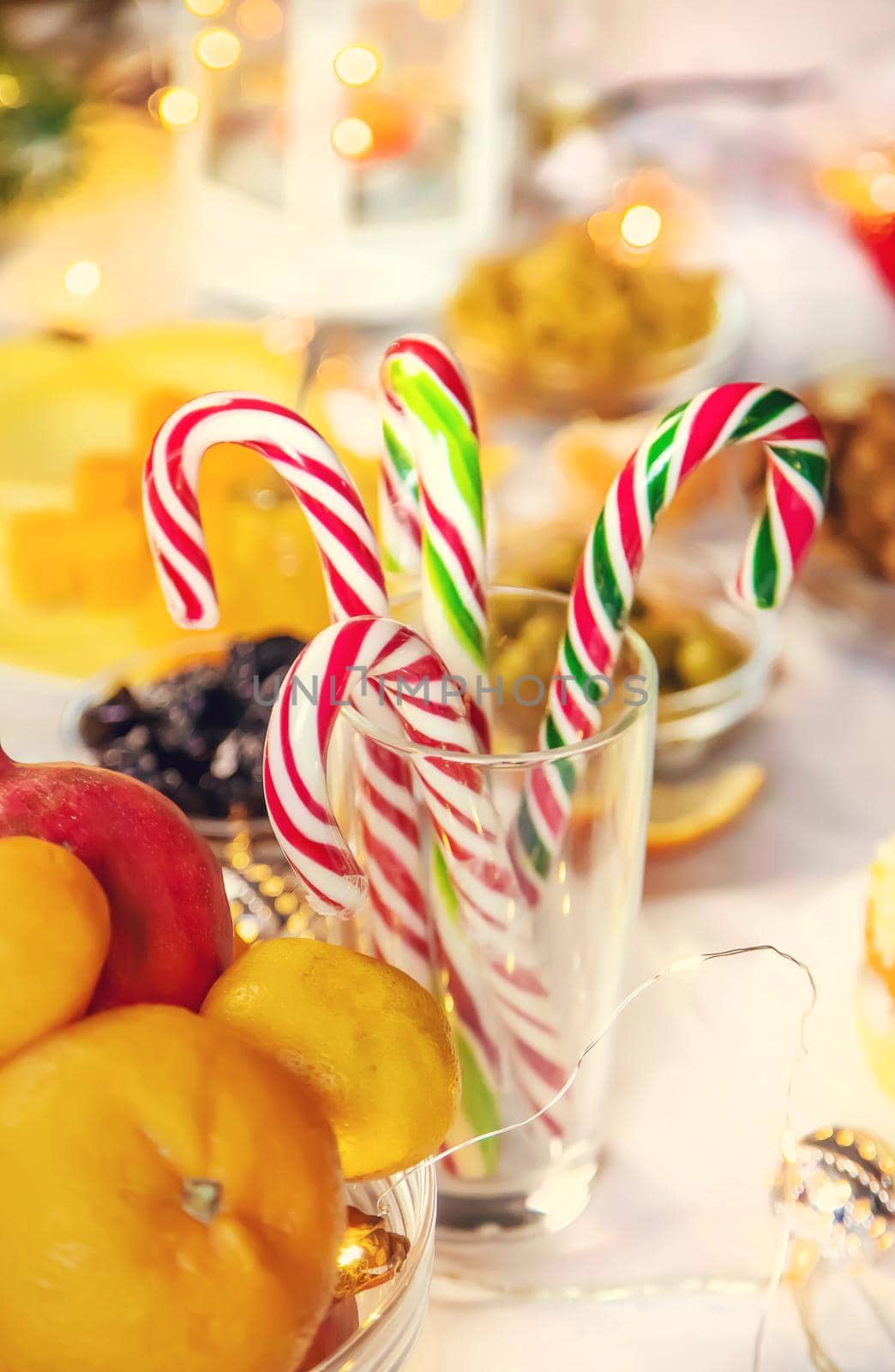 Christmas table with champagne and food. Selective focus. Holiday.