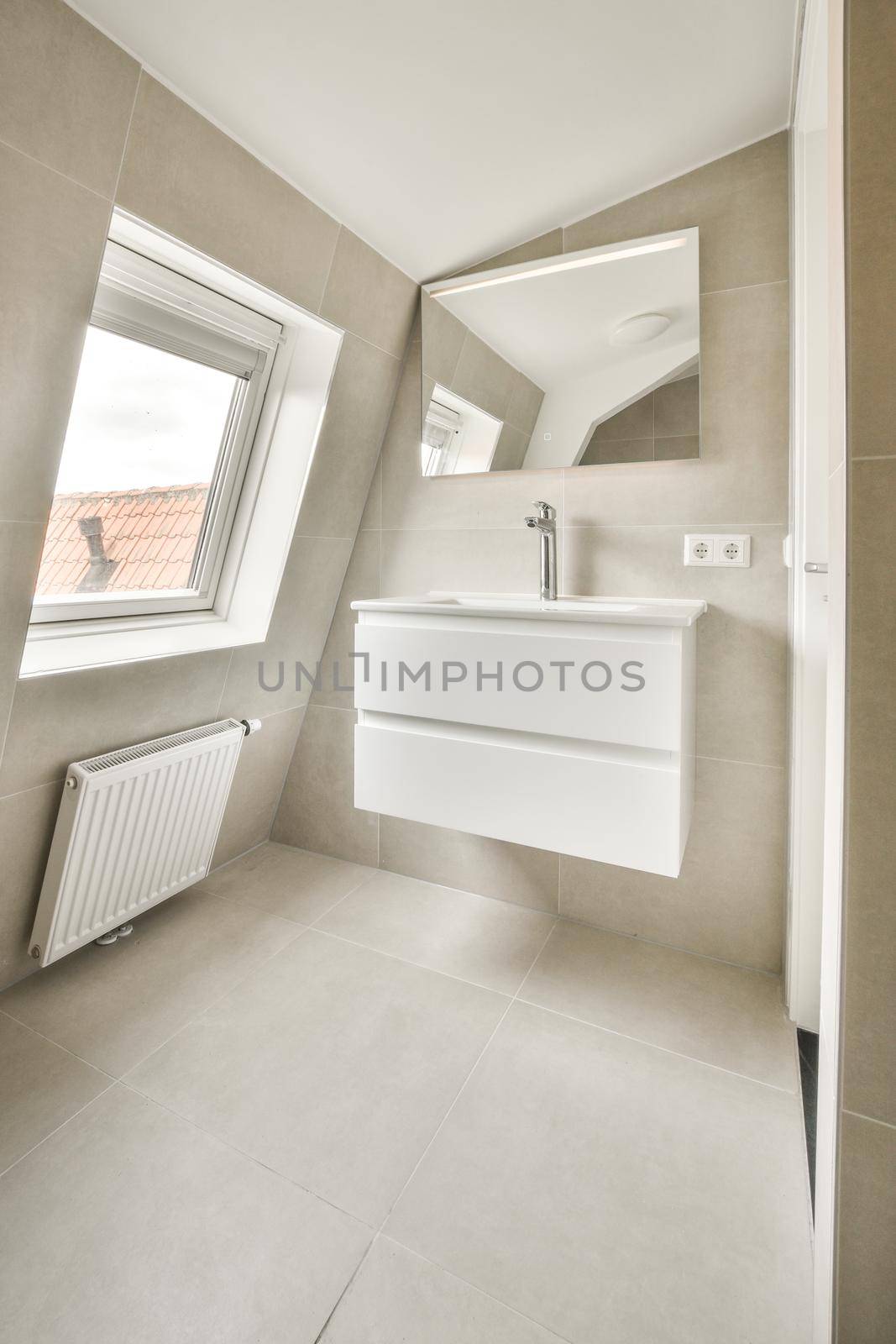 Sink with tap and liquid soap hanging on tiled wall under mirror in contemporary restroom at home