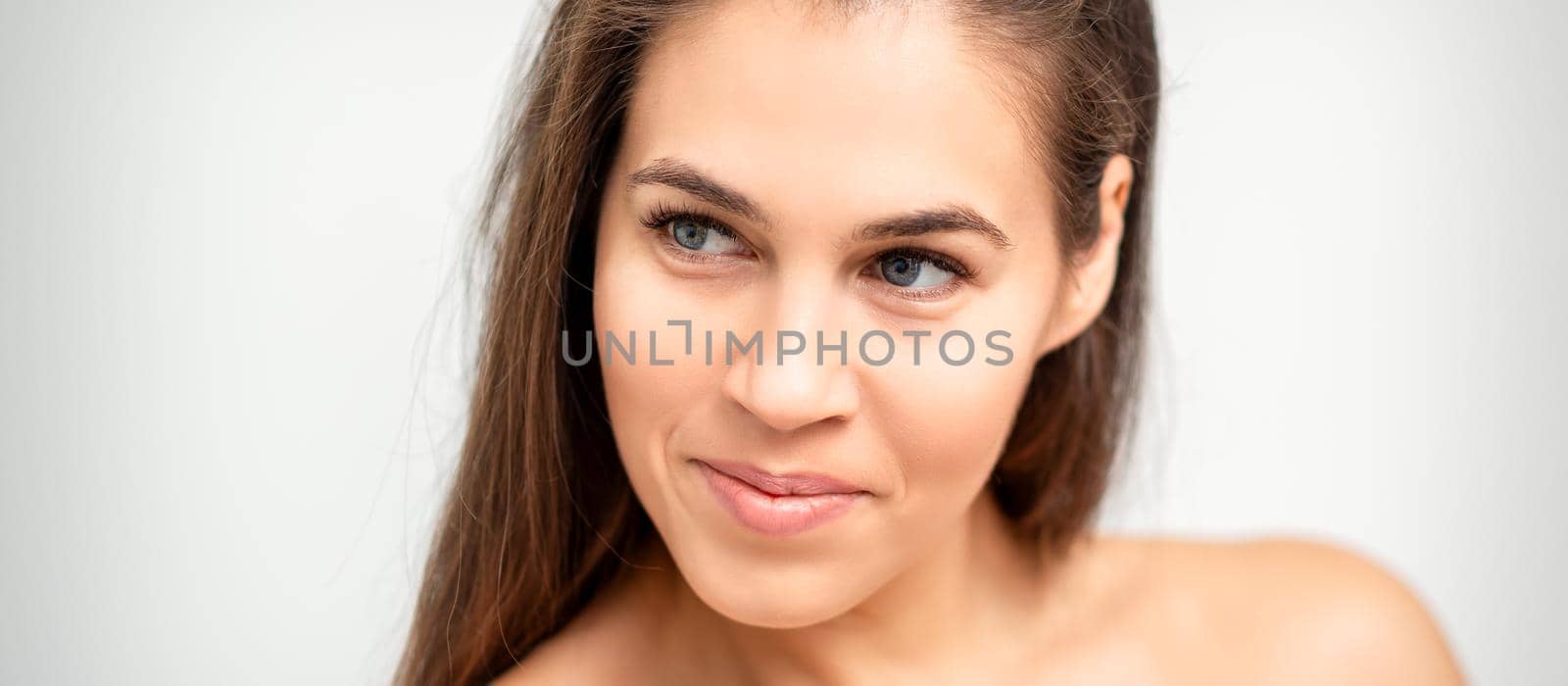 Face portrait of young caucasian woman by okskukuruza