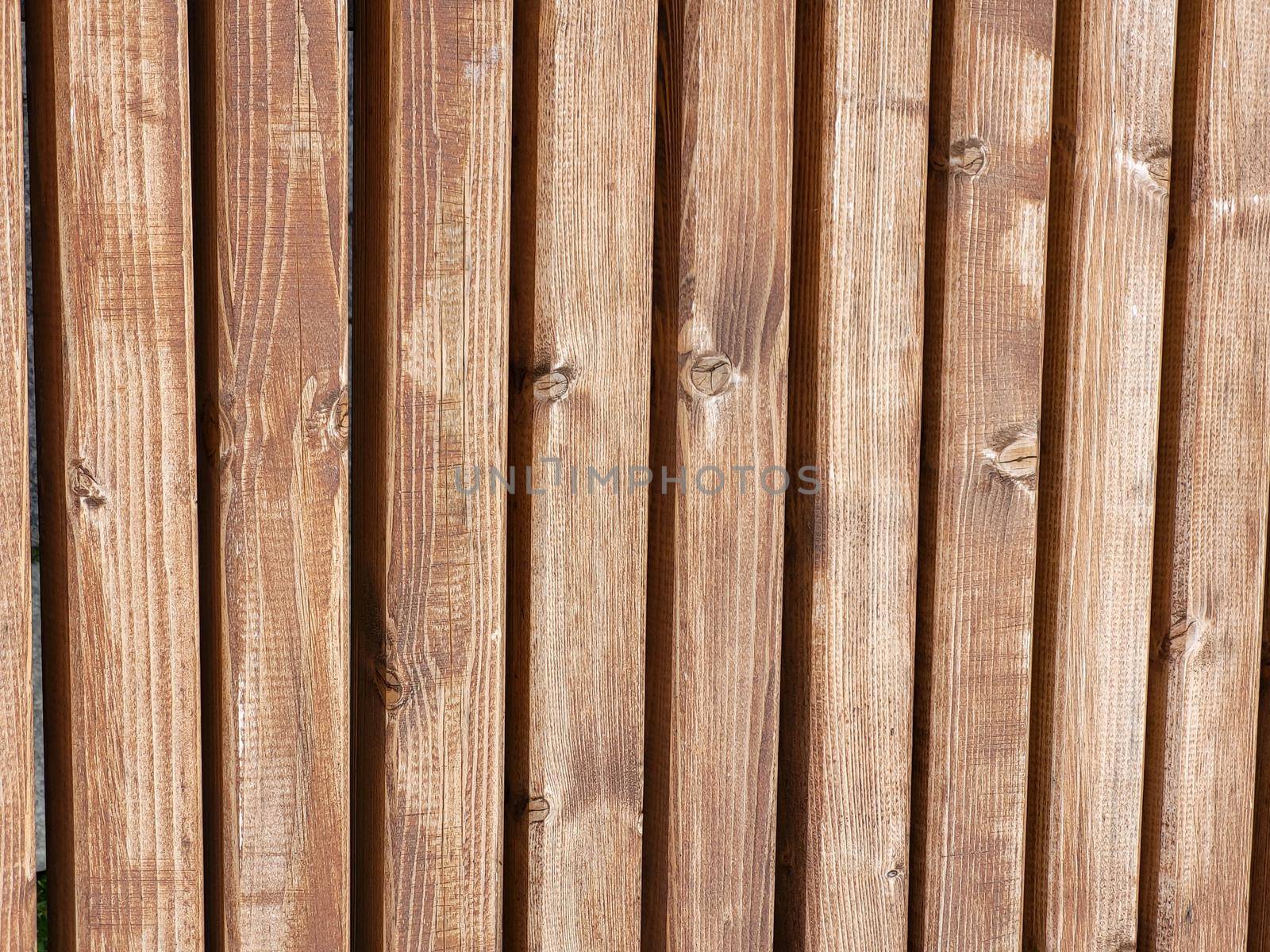 Brown wooden boardwalk. Beautiful rustic wooden background by lapushka62