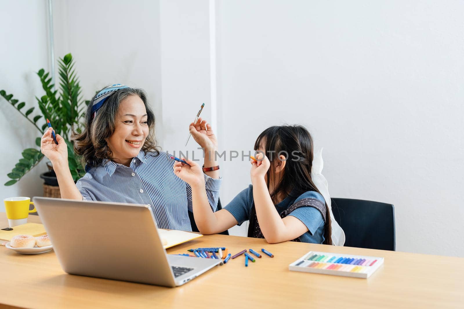 Asian portrait, grandchild granddaughter grandma grandmother and granddaughter happily join in activities to enhance skills for grandchildren.