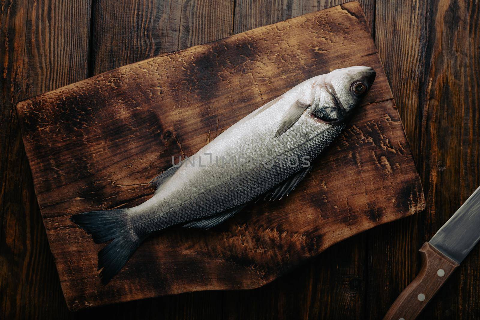 Sea Bass on Cutting Board. View from Above
