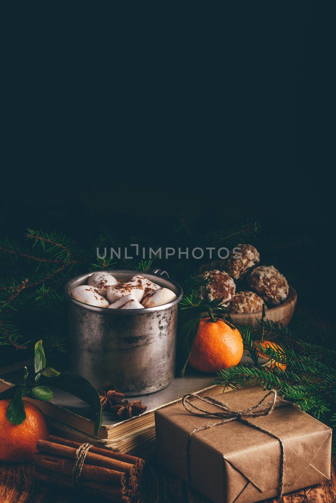 Mug of hot chocolate with marshmallows. Tangerine, Christmas decorations and gift.