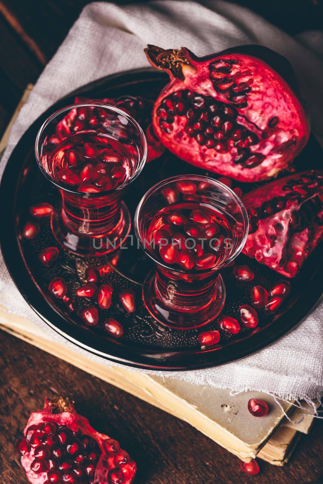Pomegranate cocktail with vodka, juice and fresh fruit