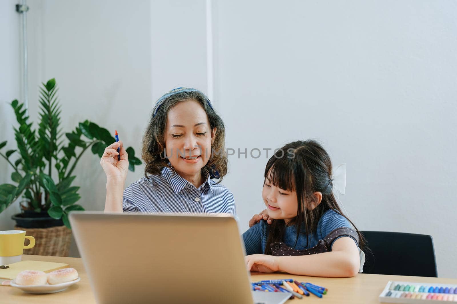 Asian portrait, grandchild granddaughter grandma grandmother and granddaughter happily join in activities to enhance skills for grandchildren by Manastrong