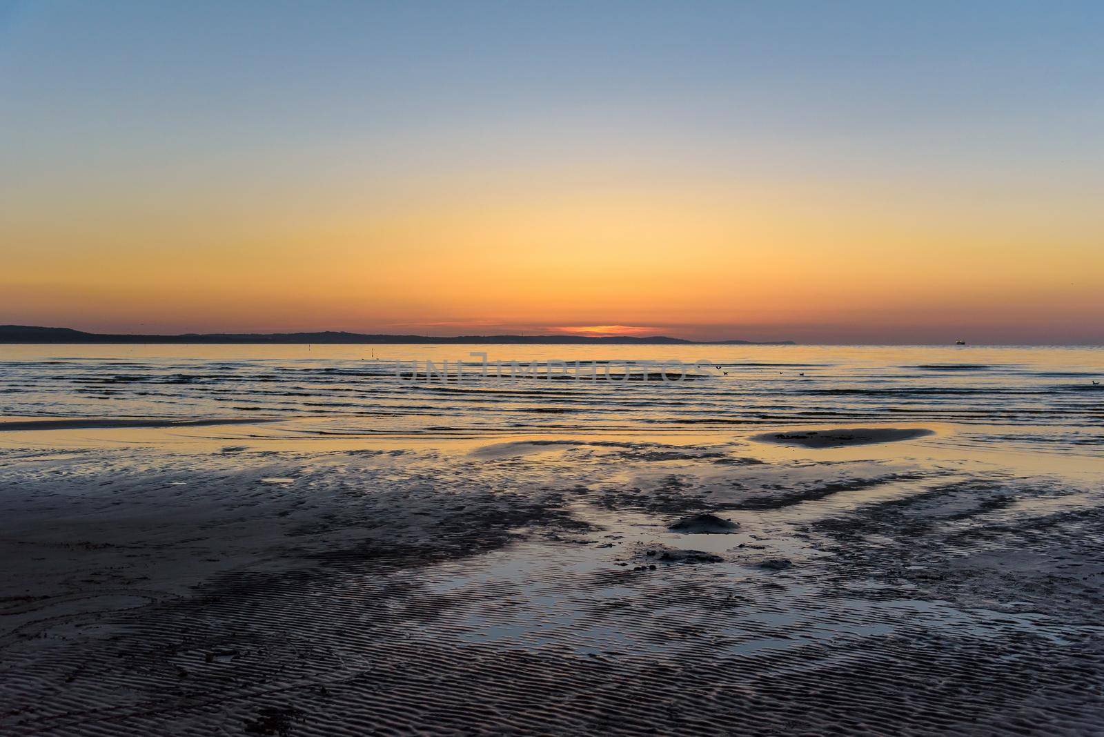 Picturesque sunset at Baltic sea in Swinoujscie in Poland