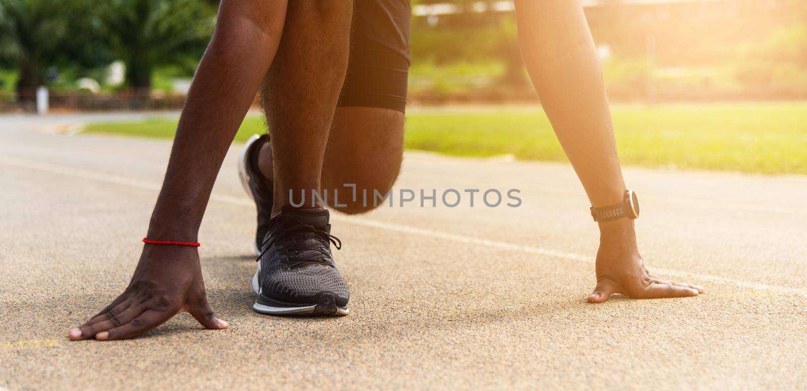Asian young athlete sport runner black man wear feet shoe active ready to start running training at the outdoor on the treadmill for a step forward, healthy exercise workout, closeup face front