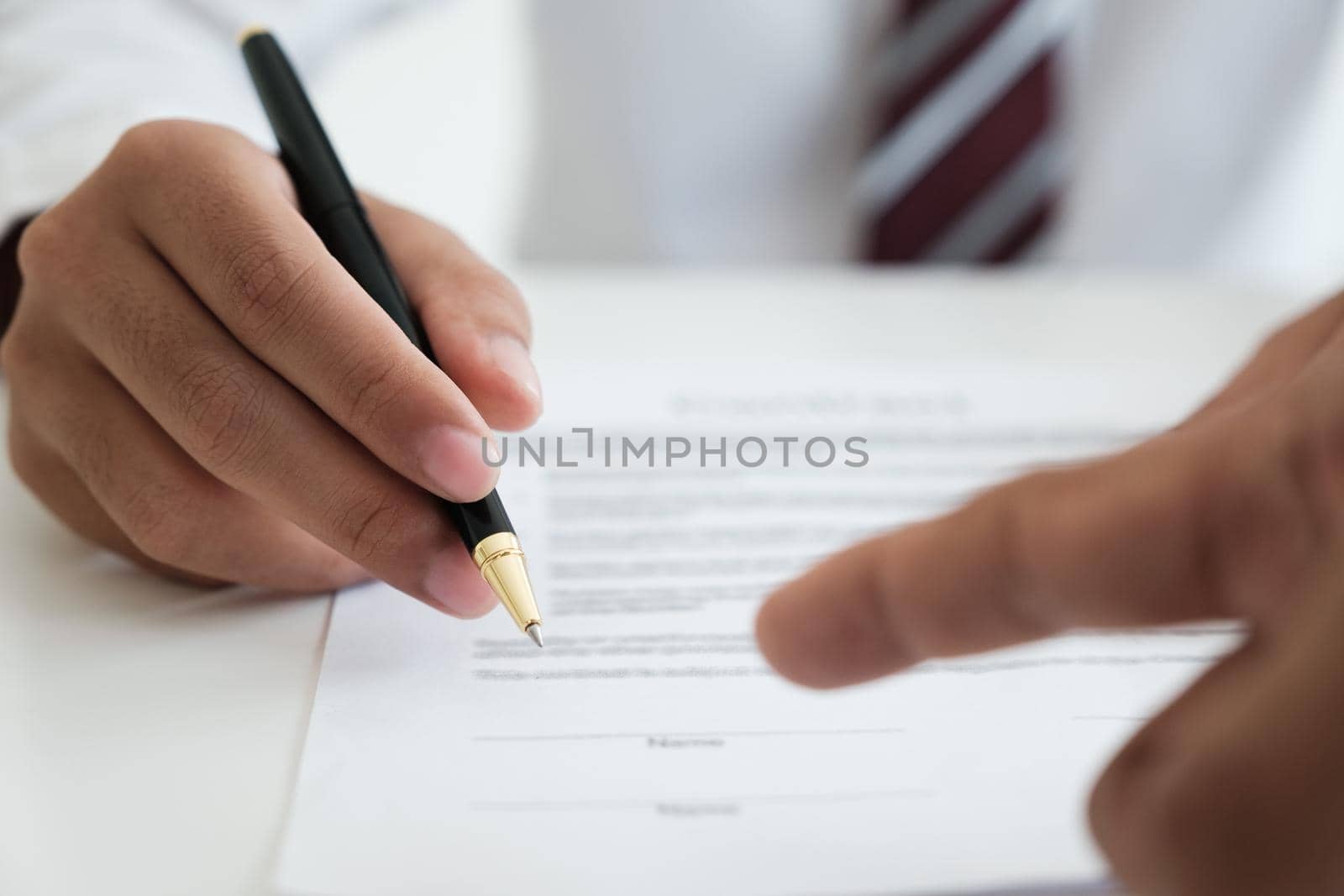 Close up businessman signing contract, partnership agreement, making deal  by ijeab