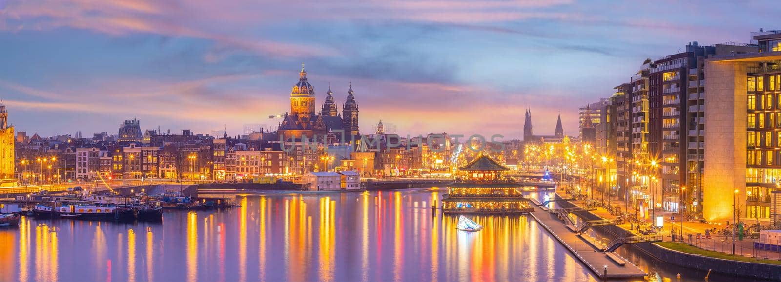 Amsterdam downtown city skyline cityscape of Netherlands at sunset
