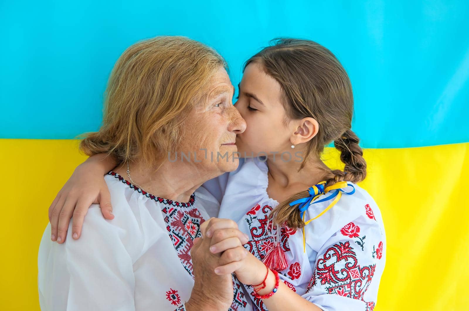 Ukrainian grandmother and granddaughter in vyshyvanka. selective focus. Kid.