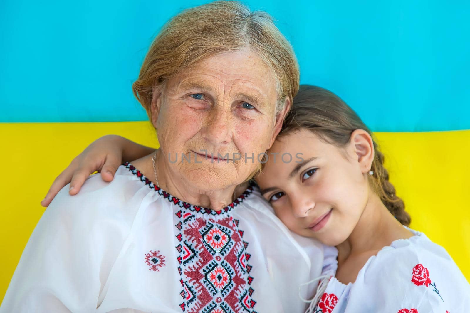Ukrainian grandmother and granddaughter in vyshyvanka. selective focus. by yanadjana