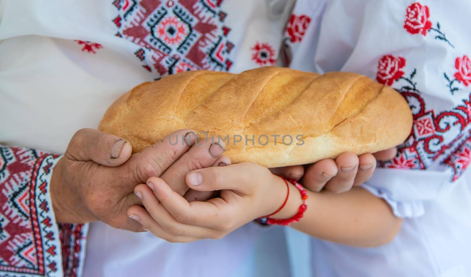 Ukrainian grandmother and granddaughter in vyshyvanka. selective focus. Kid.