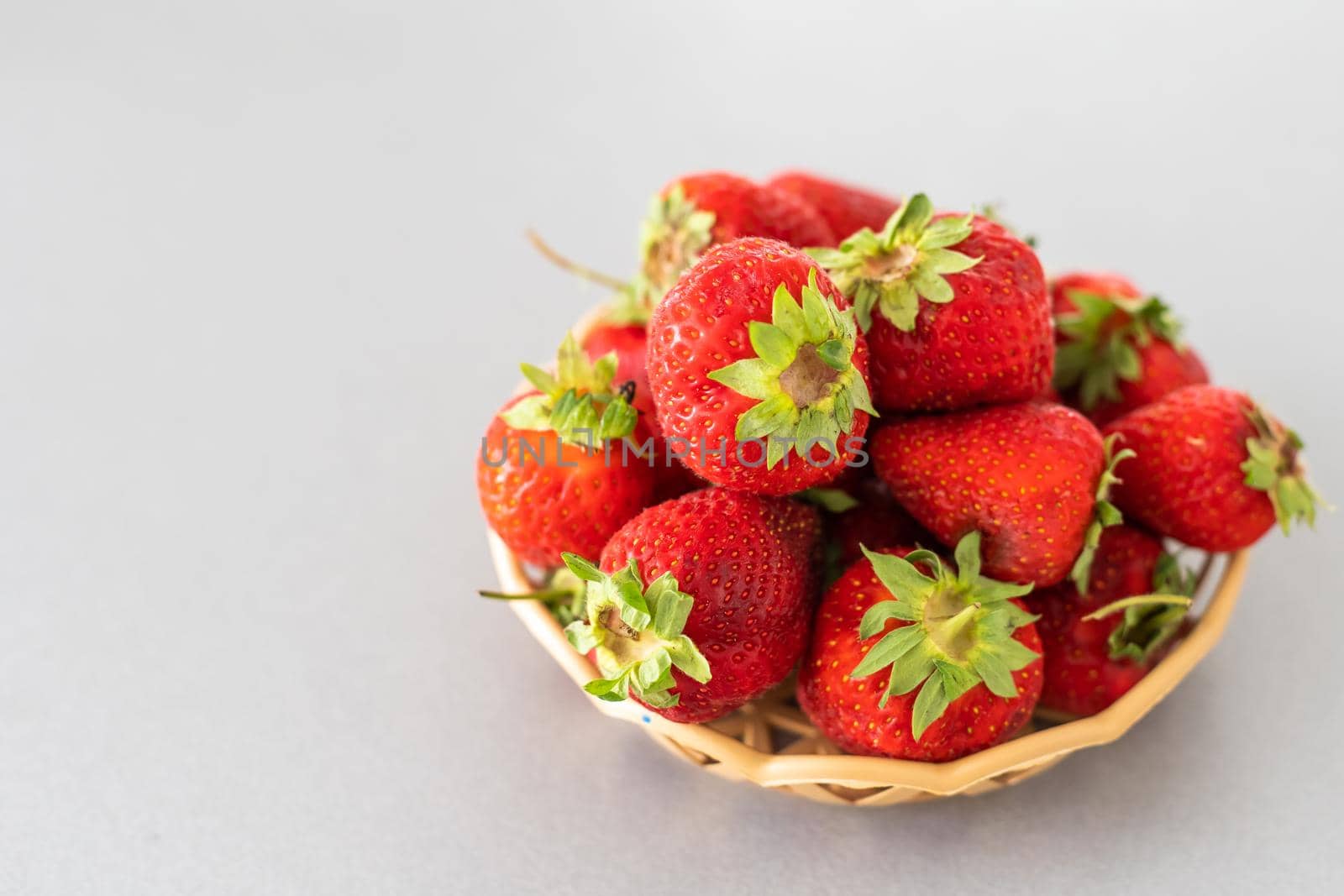 strawberries in a wicker plate by Andelov13