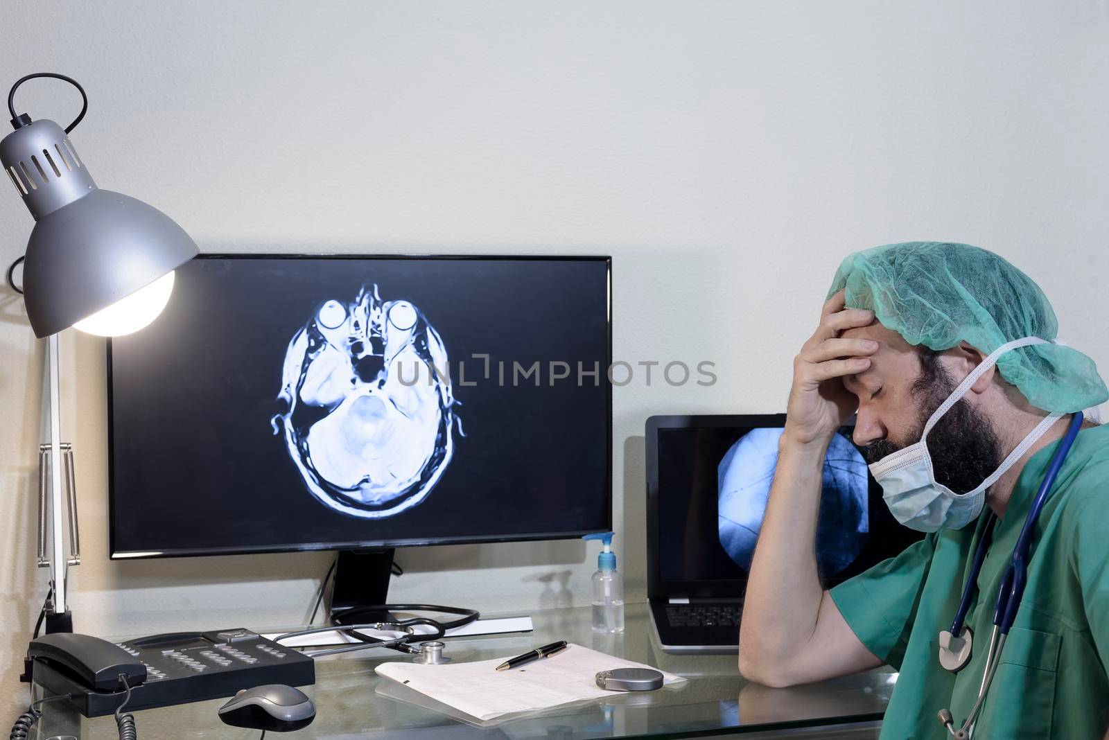 Male doctor sitting sad and feeling stressed I was disappointed with the operation in the operating room at the hospital