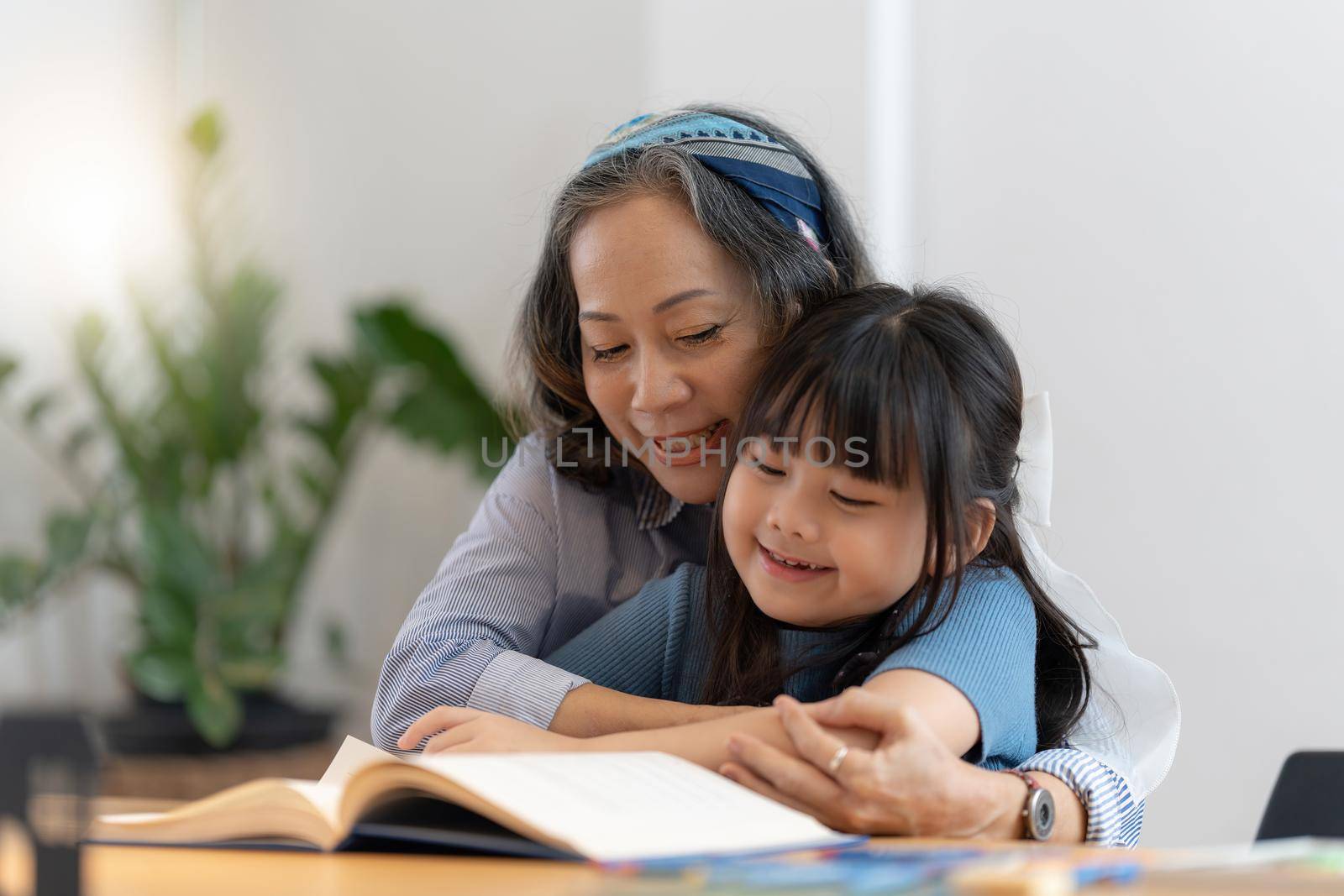 Happy moment of Daughter enjoying time together with mother at home. little child girl having fun