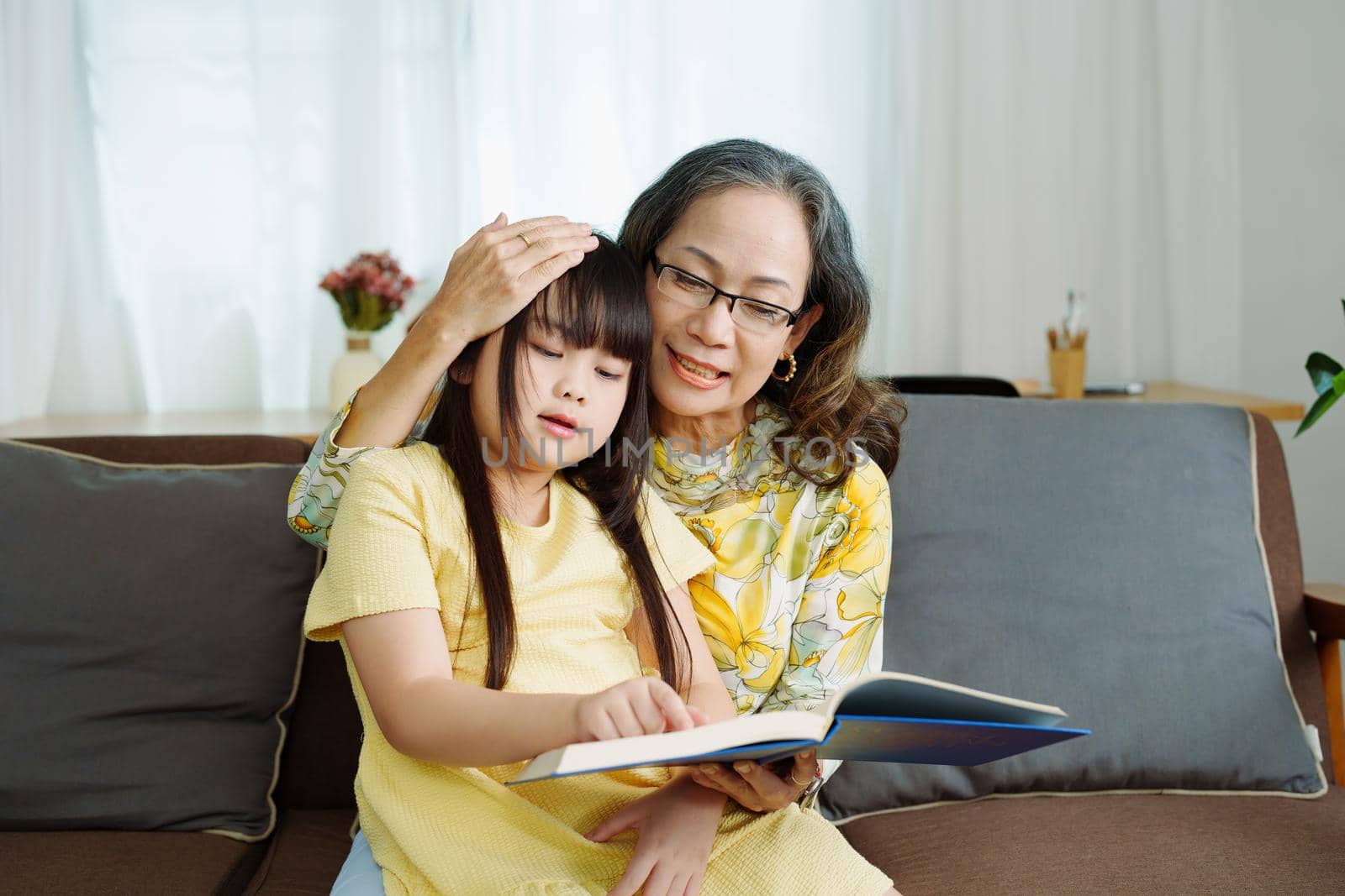 Asian portrait, grandchild granddaughter grandma grandmother and granddaughter happily join in activities to enhance skills for grandchildren by Manastrong