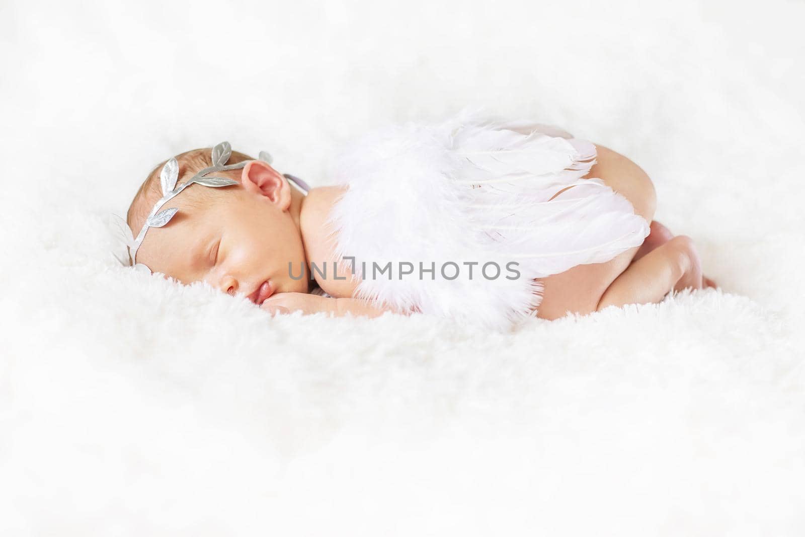 Newborn angel photo session in a suit. Selective focus. by yanadjana