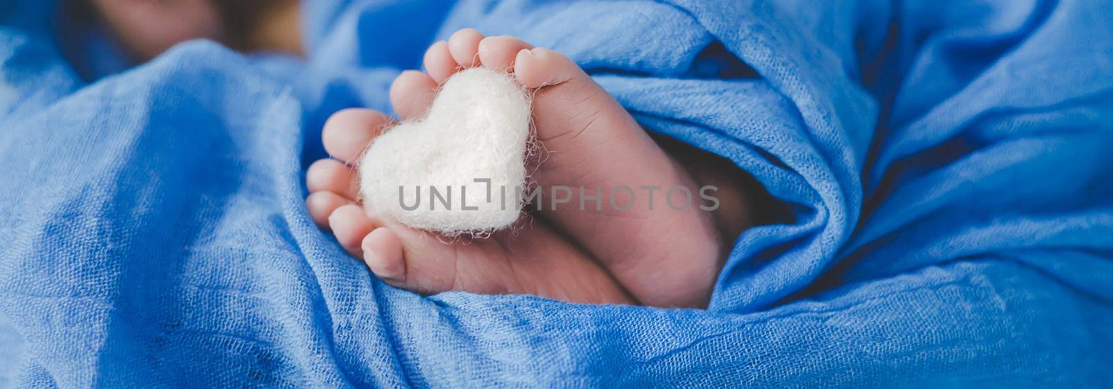 Newborn baby sleeping on a blue background. Selective focus. people.