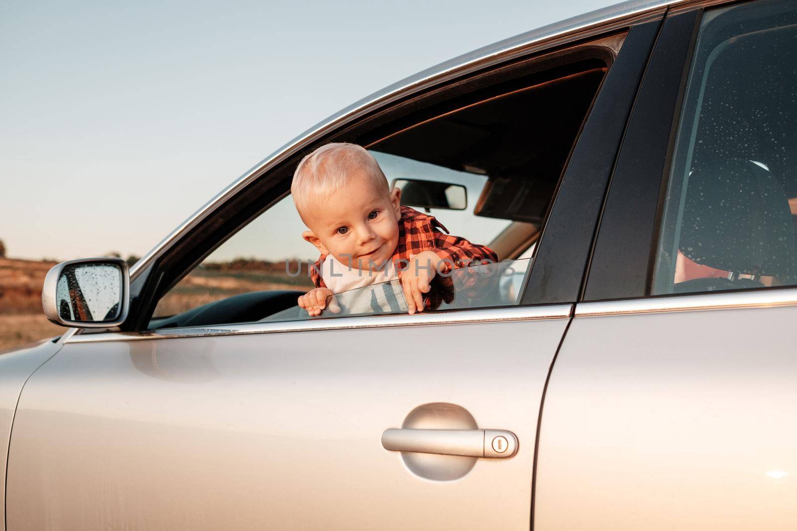 Portrait of a One Little Boy Playing with Car