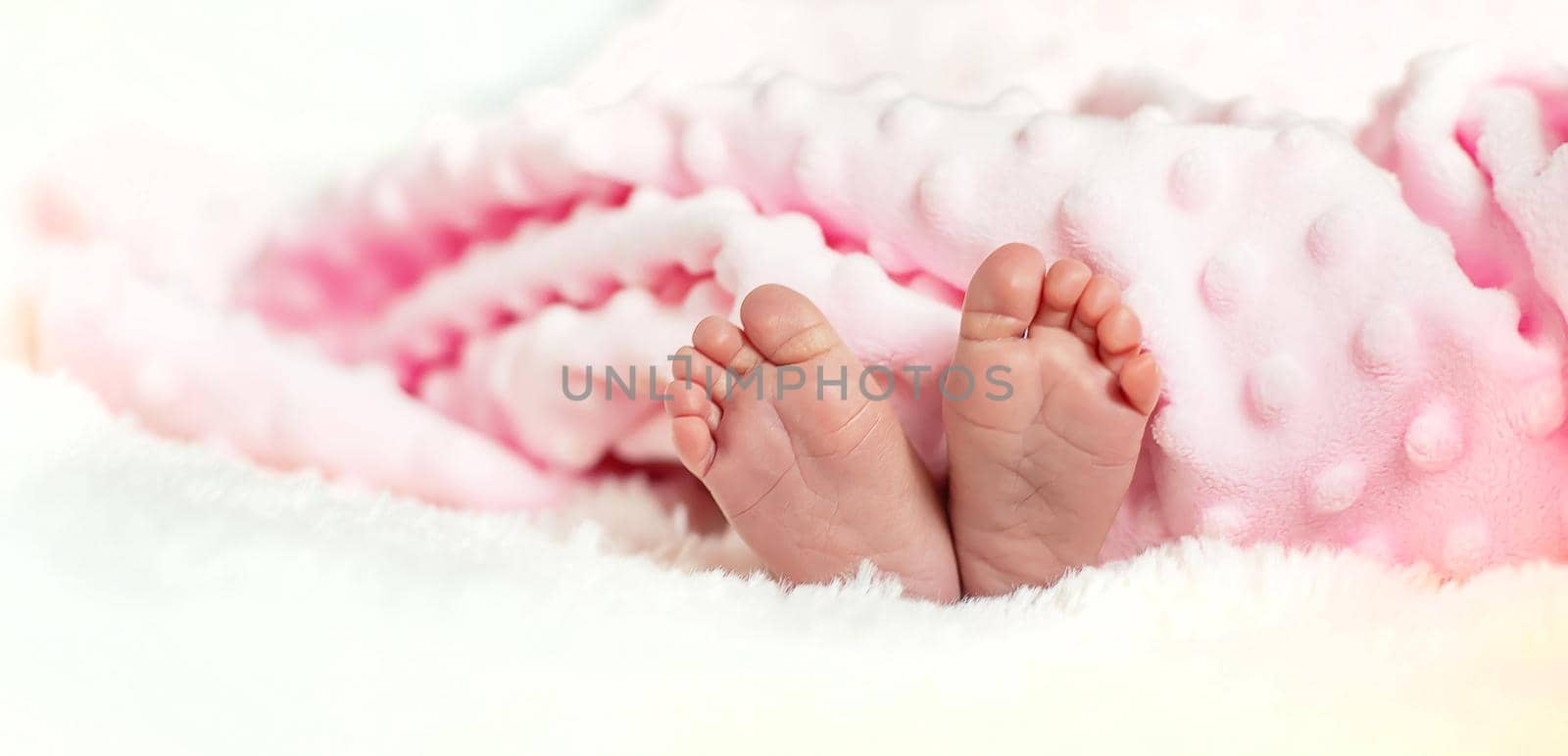 newborn baby mom holds legs. selective focus. by yanadjana