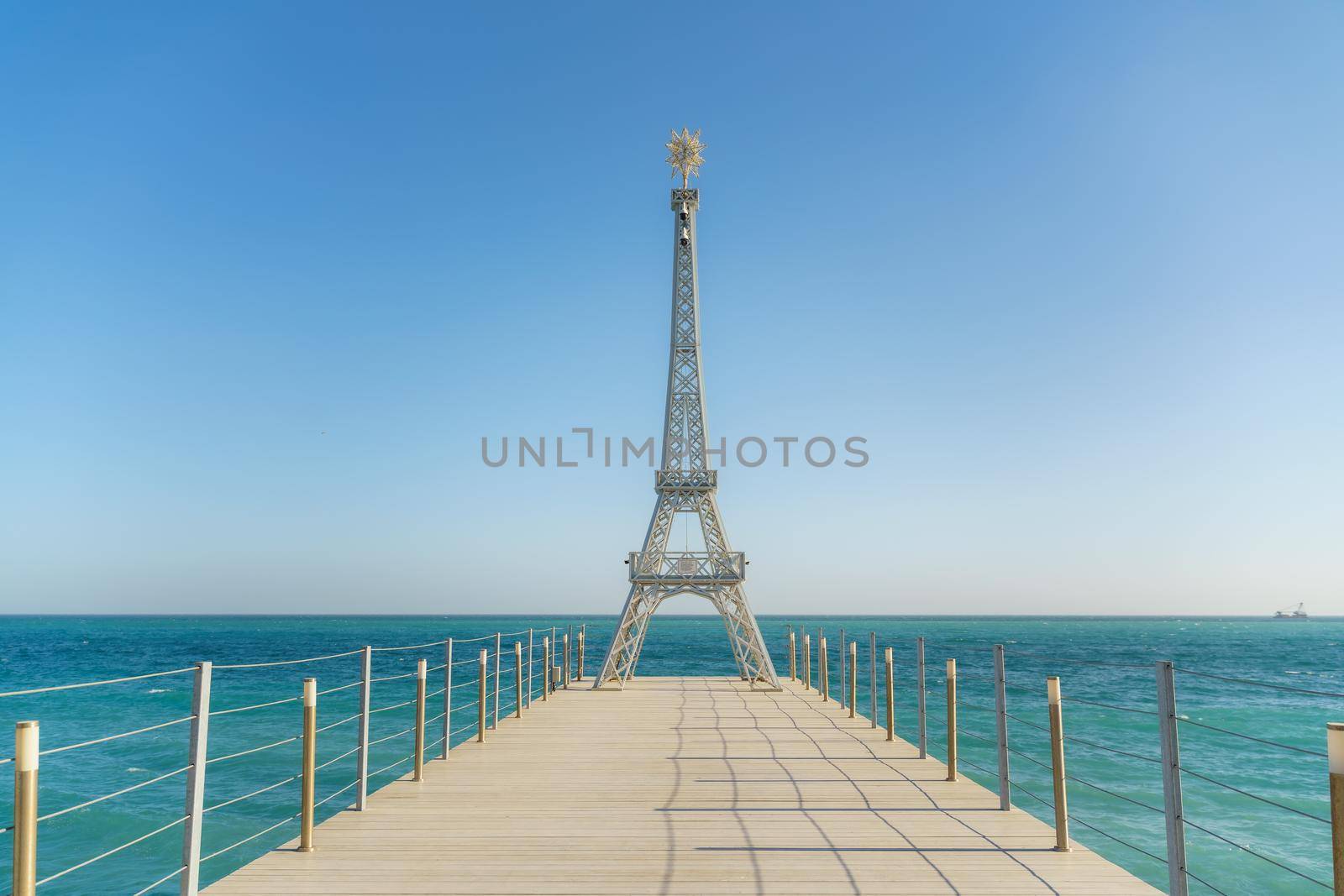 Large model of the Eiffel Tower on the beach