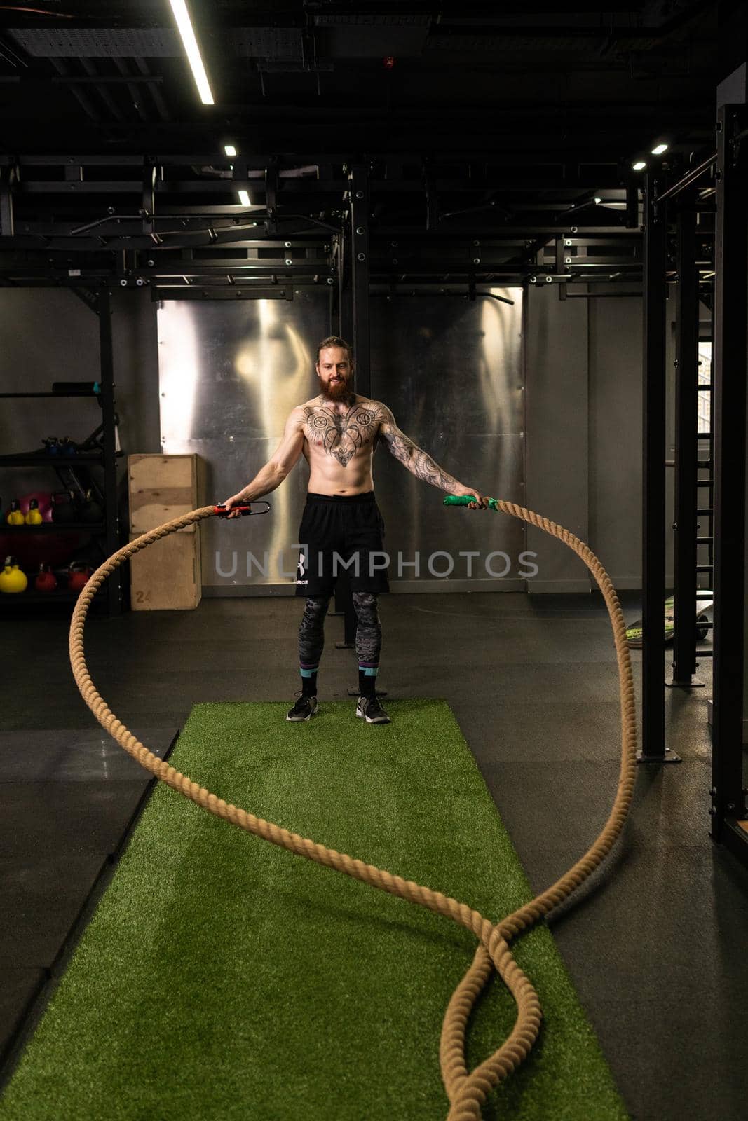 Rope man training gym warehouse fitness muscular exercising effort athlete, for strong fit from battle from practicing health, person wave. Field men outdoors,