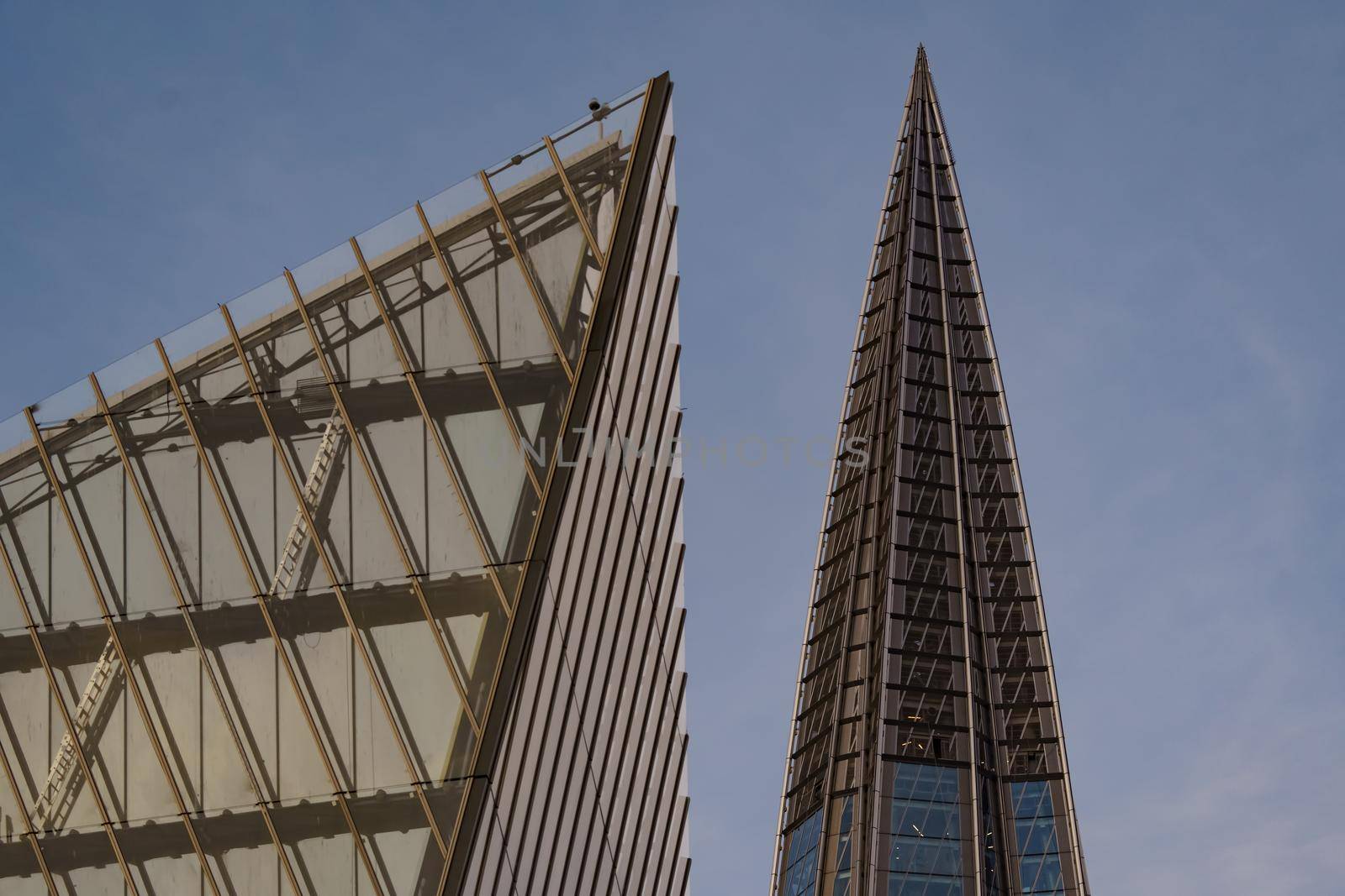 Russia, St. Petersburg, 10 June 2022: The spire of skyscraper Lakhta center of the gas company Gazprom at sunset, glass and iron facade. High quality photo