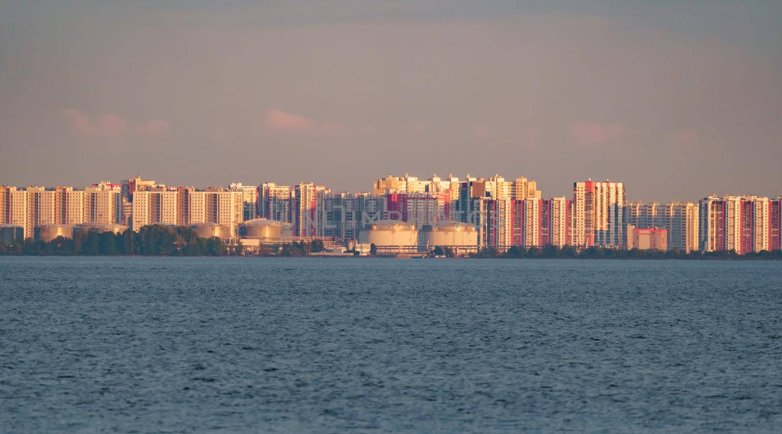 The residential complex on the embankment of the Neva River on Vasilievsky island in sunset. High quality photo
