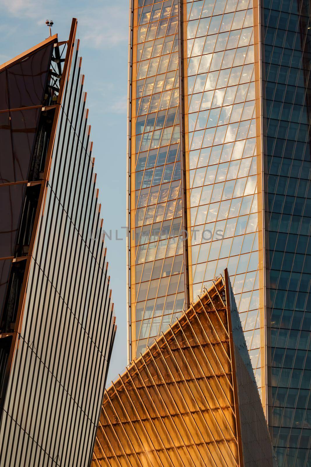 Russia, St. Petersburg, 10 June 2022: The skyscraper Lakhta center of the gas company Gazprom at sunset, glass and iron facade. High quality photo