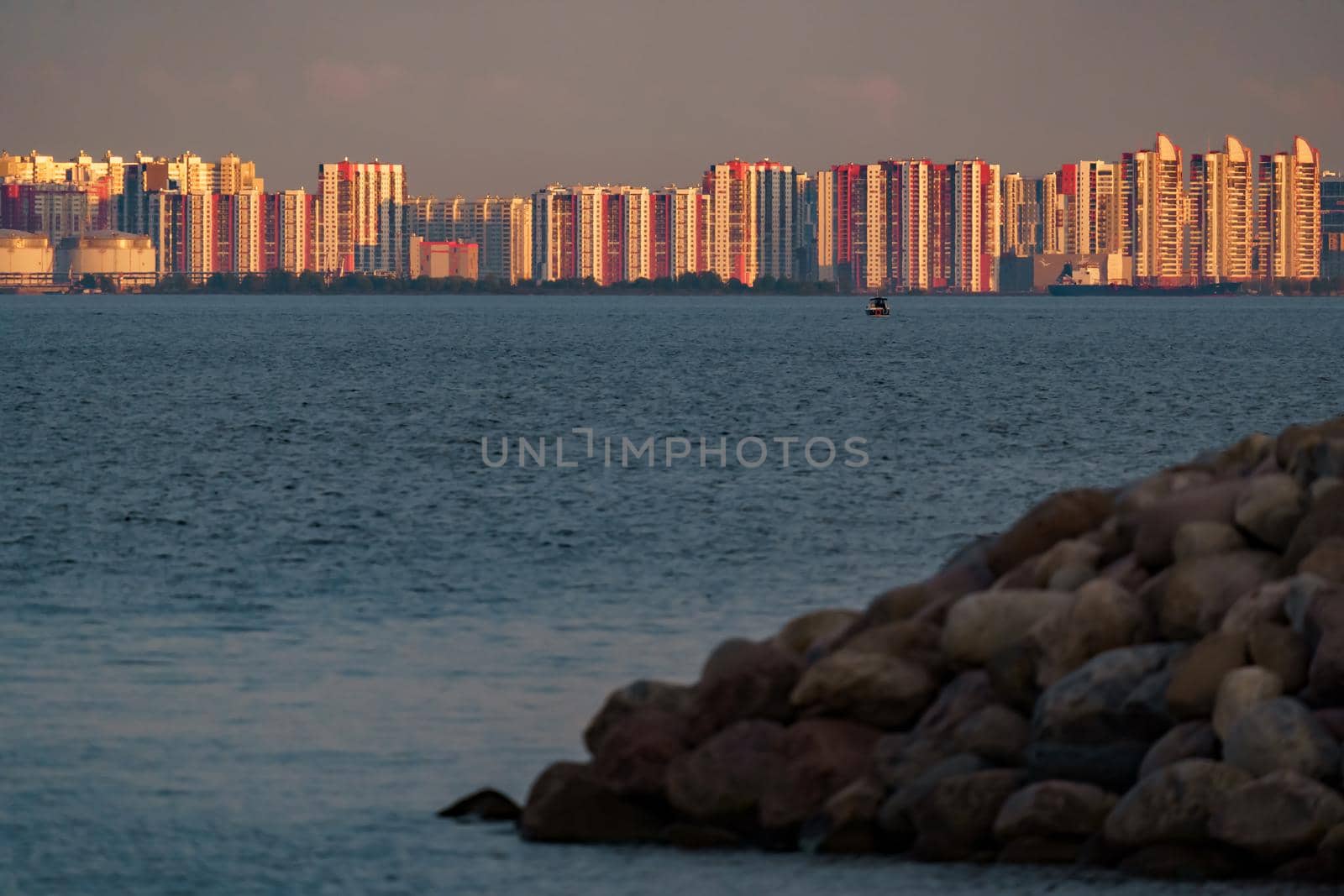 The residential complex on the embankment of the Neva River on Vasilievsky island in sunset. High quality photo