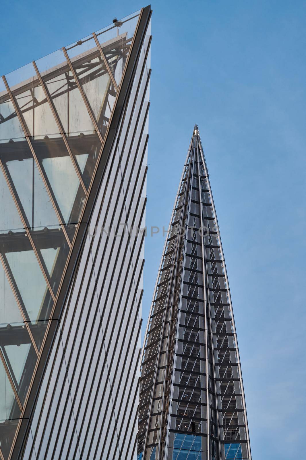 Russia, St. Petersburg, 10 June 2022: The spire of skyscraper Lakhta center of the gas company Gazprom at sunset, glass and iron facade. High quality photo