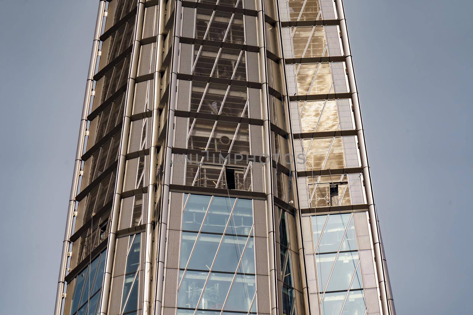 Russia, St. Petersburg, 10 June 2022: The skyscraper Lakhta center of the gas company Gazprom at sunset, glass and iron facade. High quality photo
